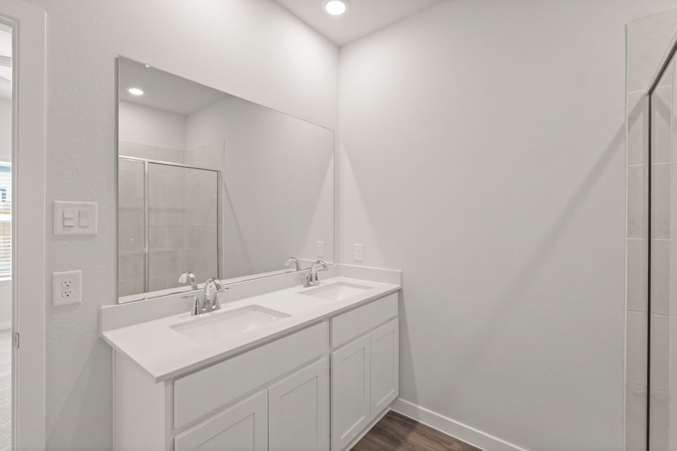 A bathroom with two sinks.