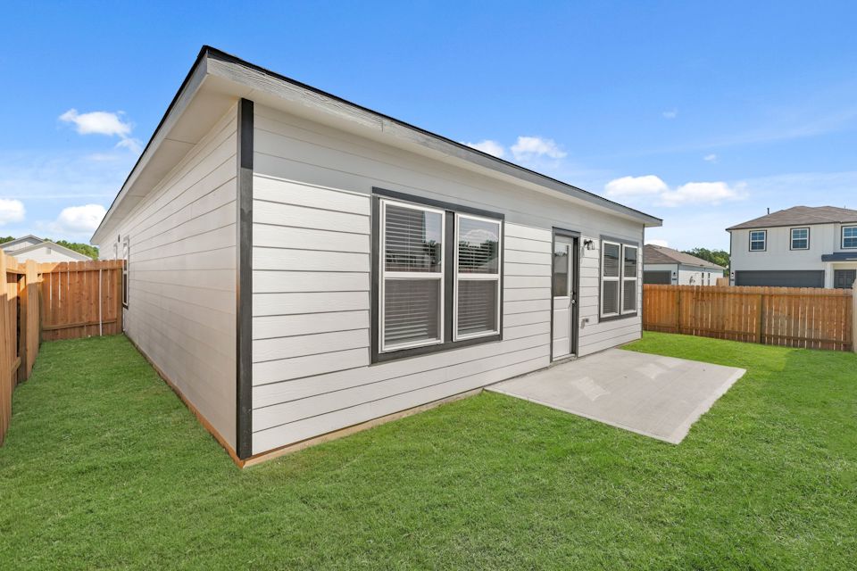 A house with a grass yard.