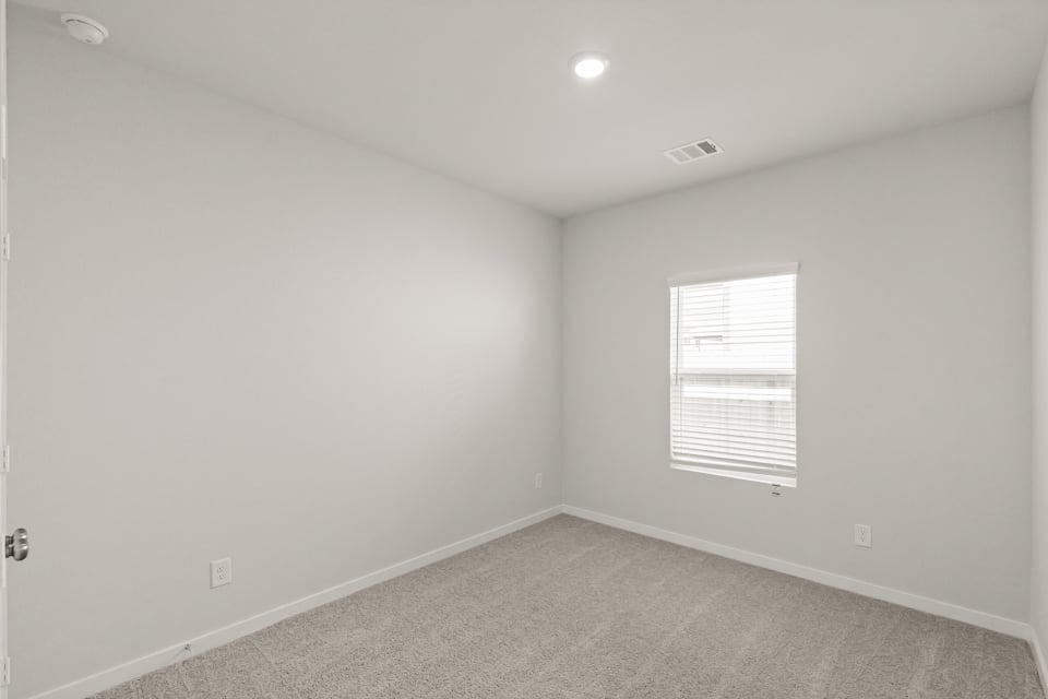 A room with a door and a window.