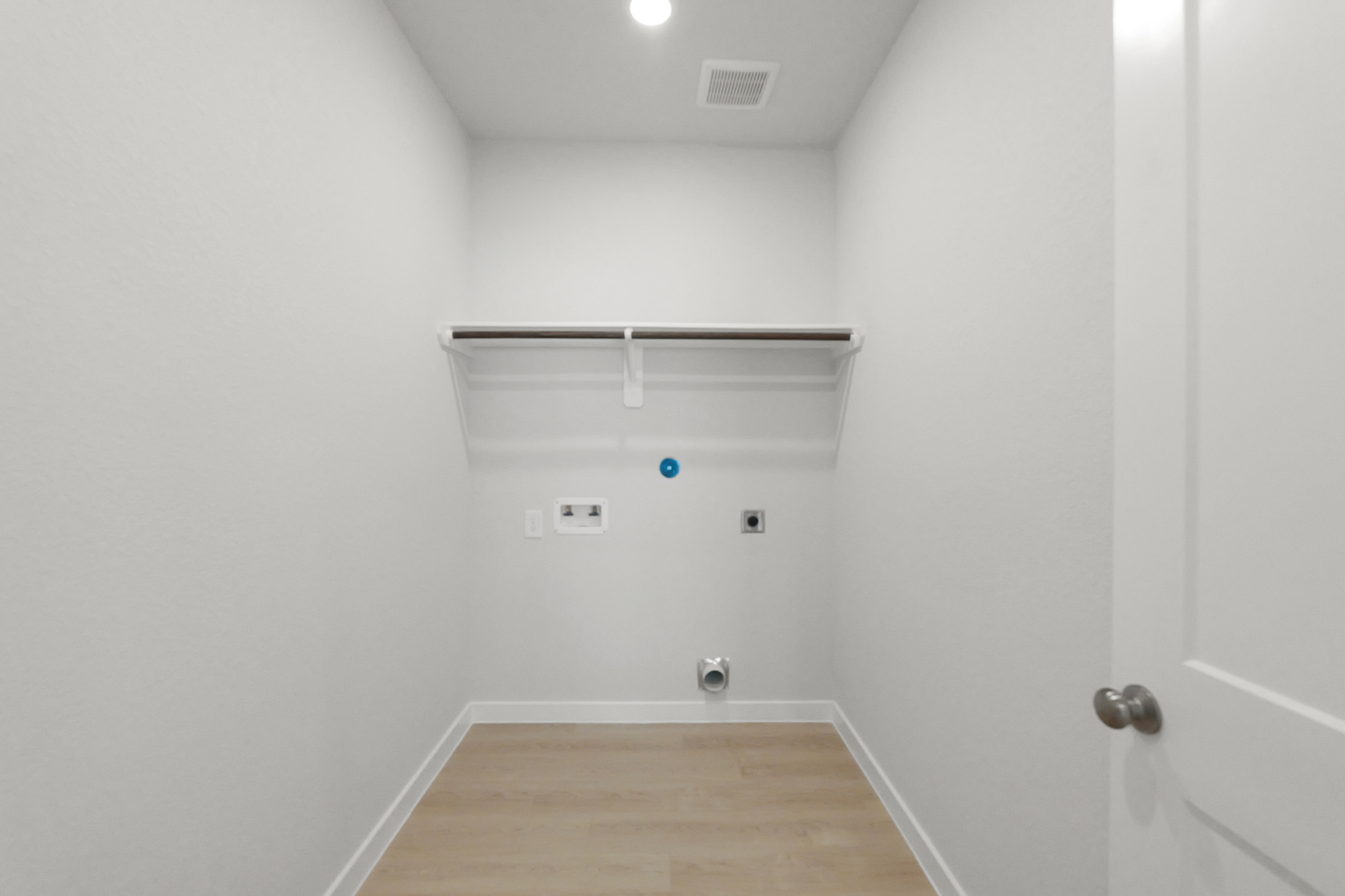 A room with a wood floor and a wood floor.