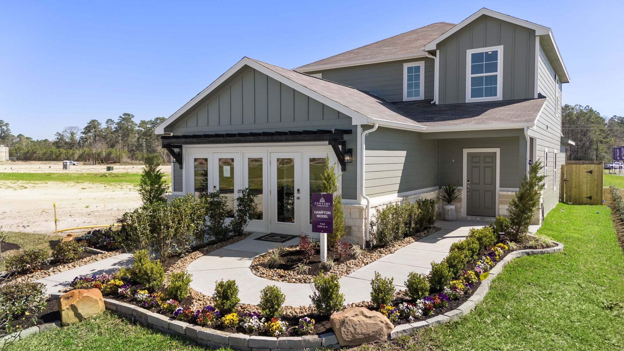 A house with a garden in front.