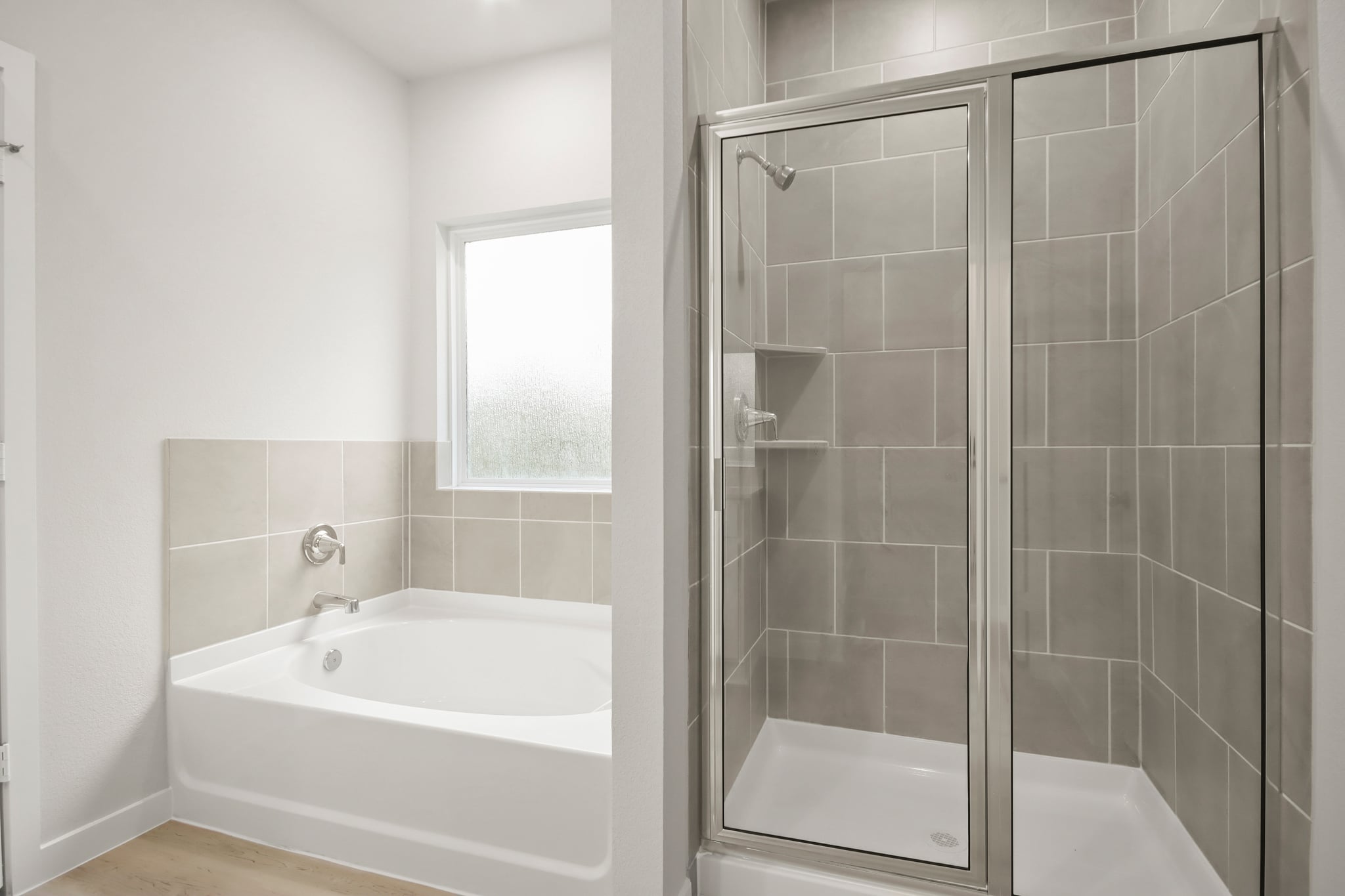 A bathroom with a glass shower.