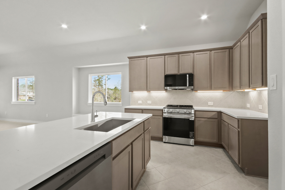 A kitchen with a sink and cabinets.