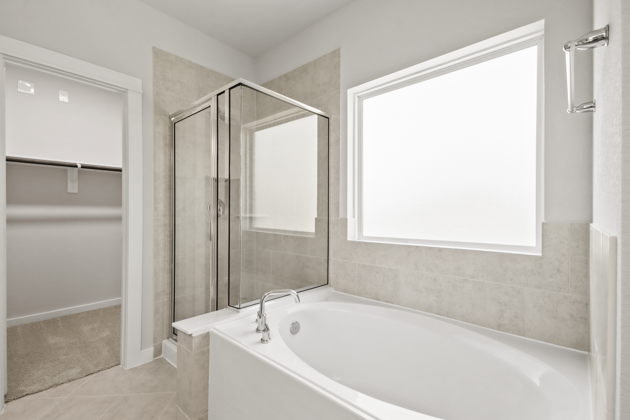 A bathroom with a tub and shower.