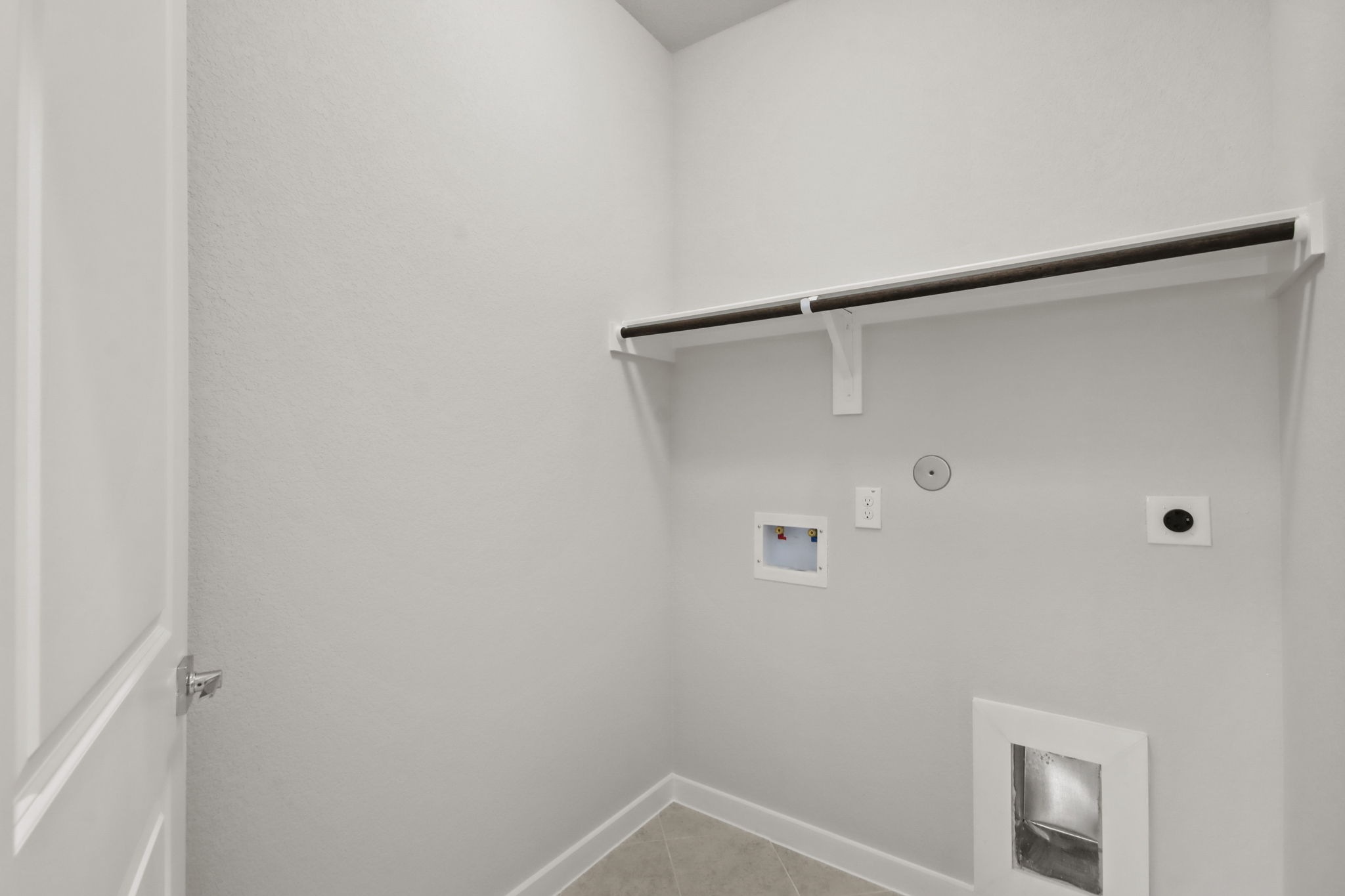 A shower with a metal bar.