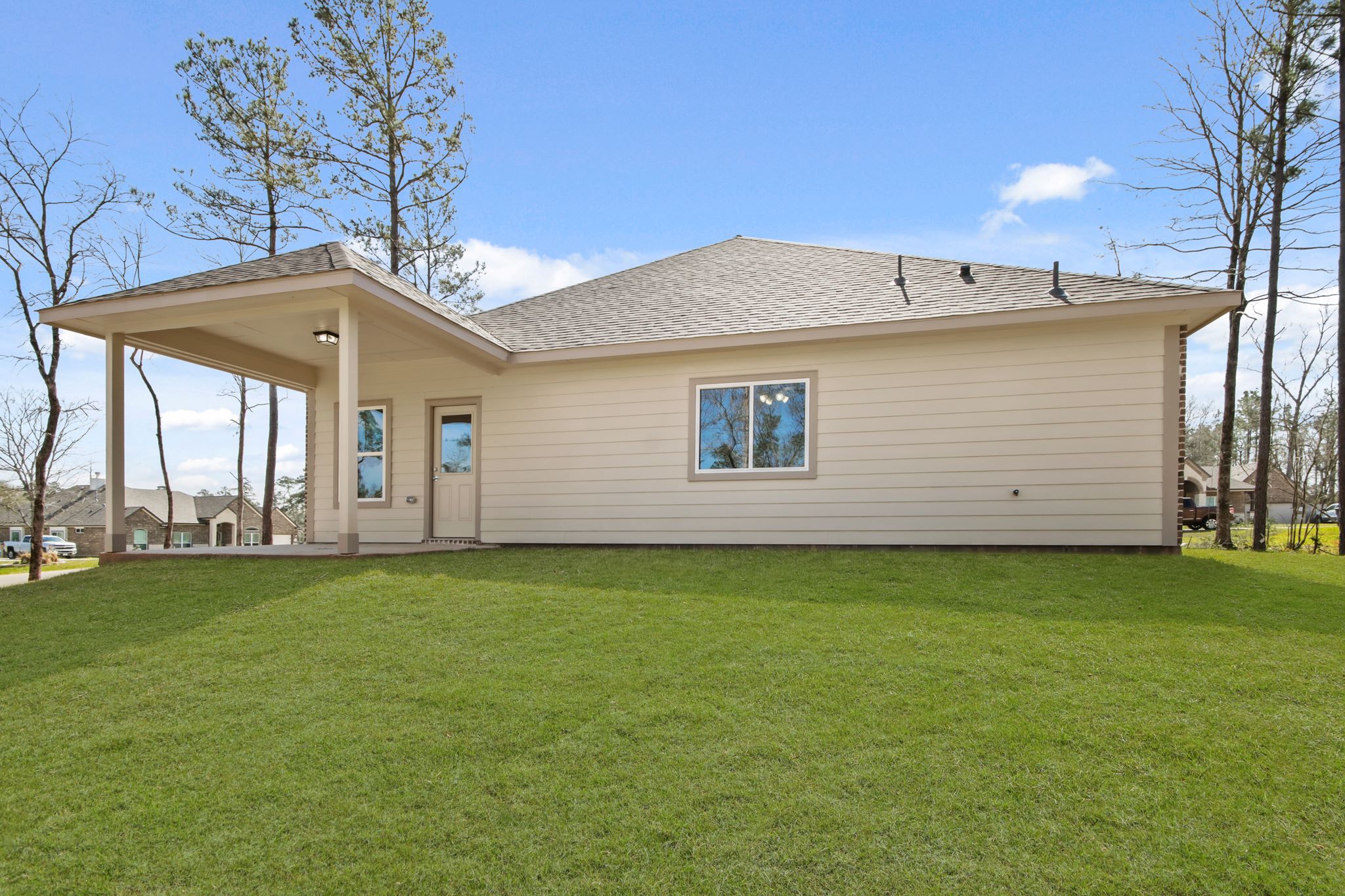 A house with a grass yard.