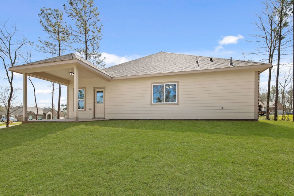 A house with a grass yard.