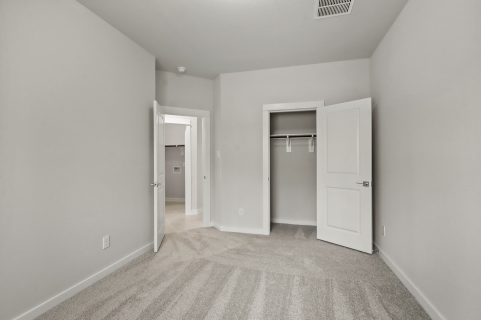 A hallway with white doors.