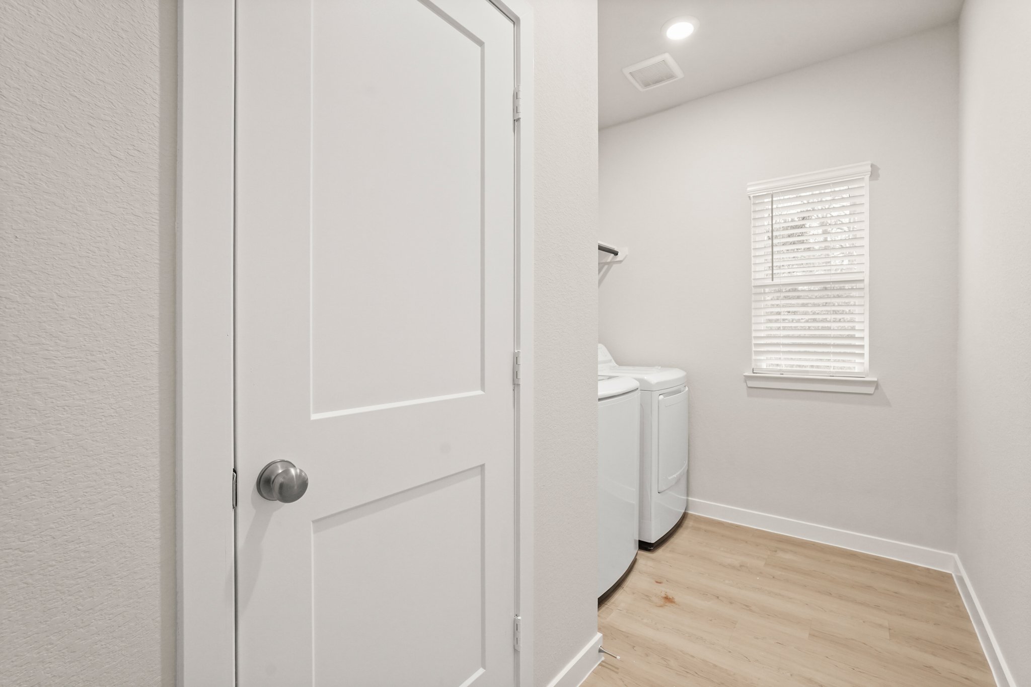 A bathroom with a toilet and a sink.