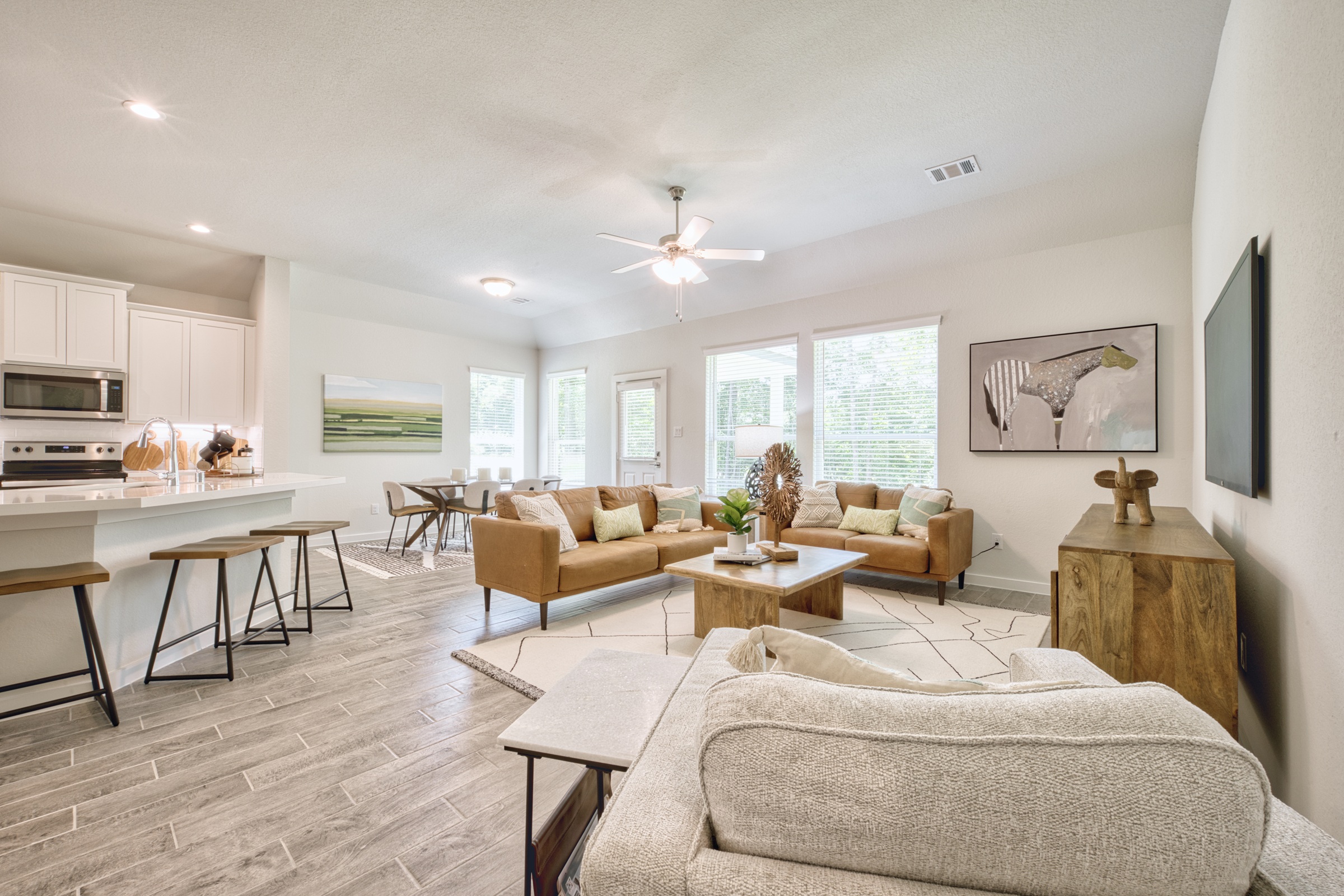 A living room with a wood floor.