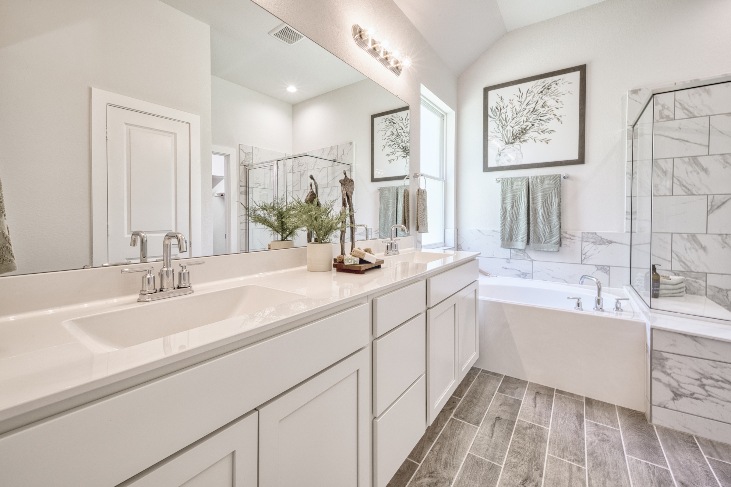 A bathroom with a tub and sink.
