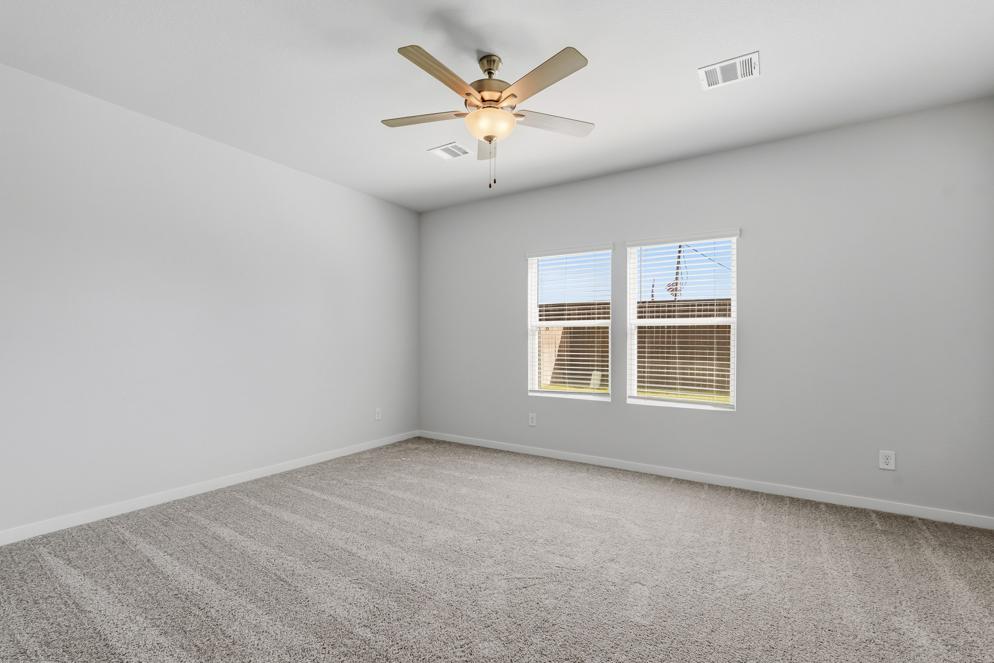 A ceiling fan in a room.