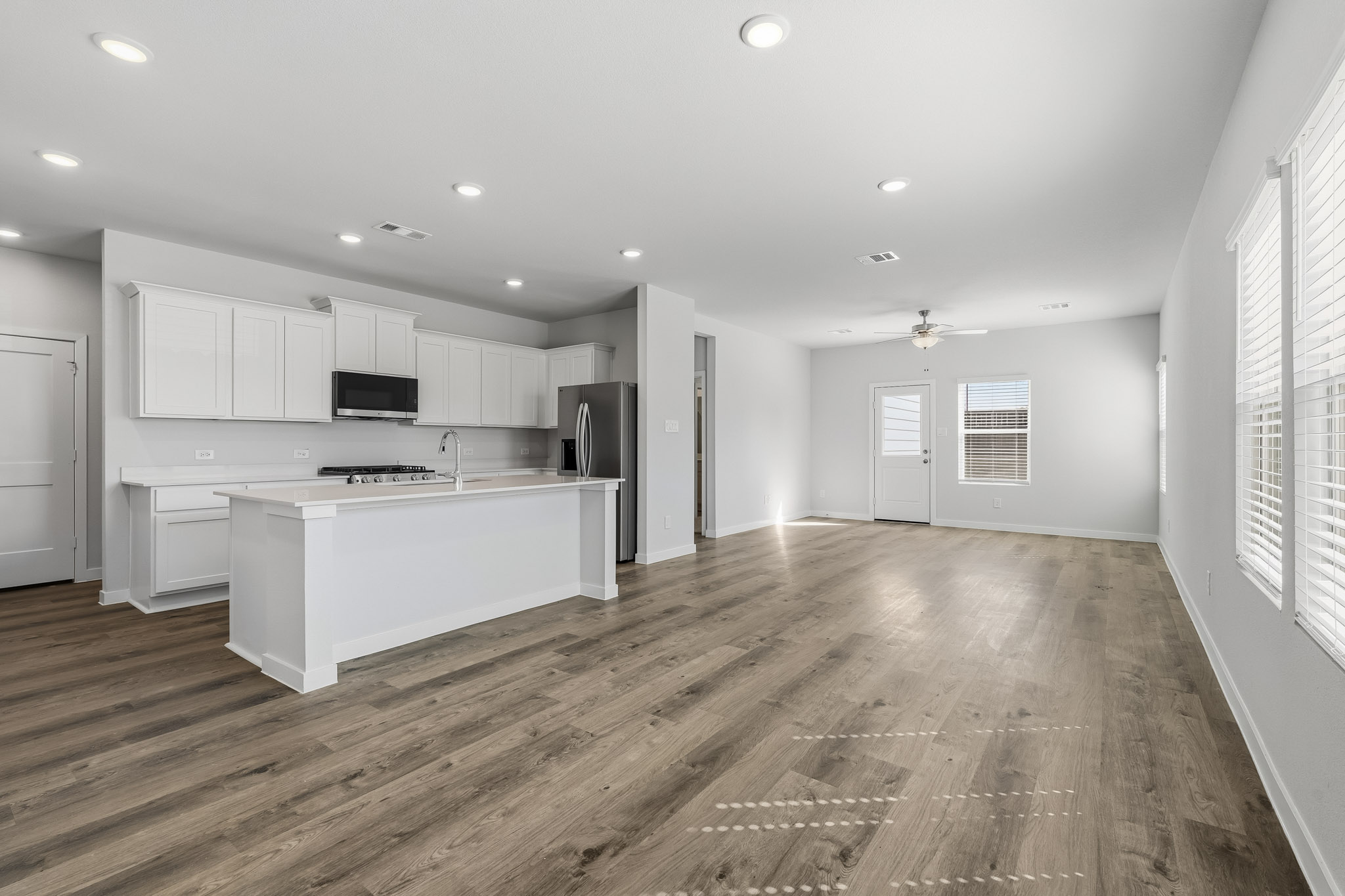 A large kitchen with white cabinets.