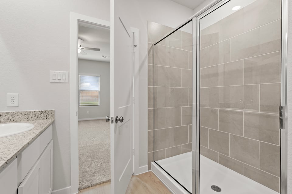 A bathroom with a glass shower.