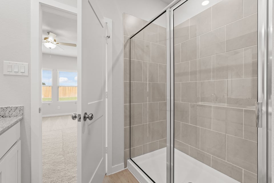 A bathroom with a glass shower.