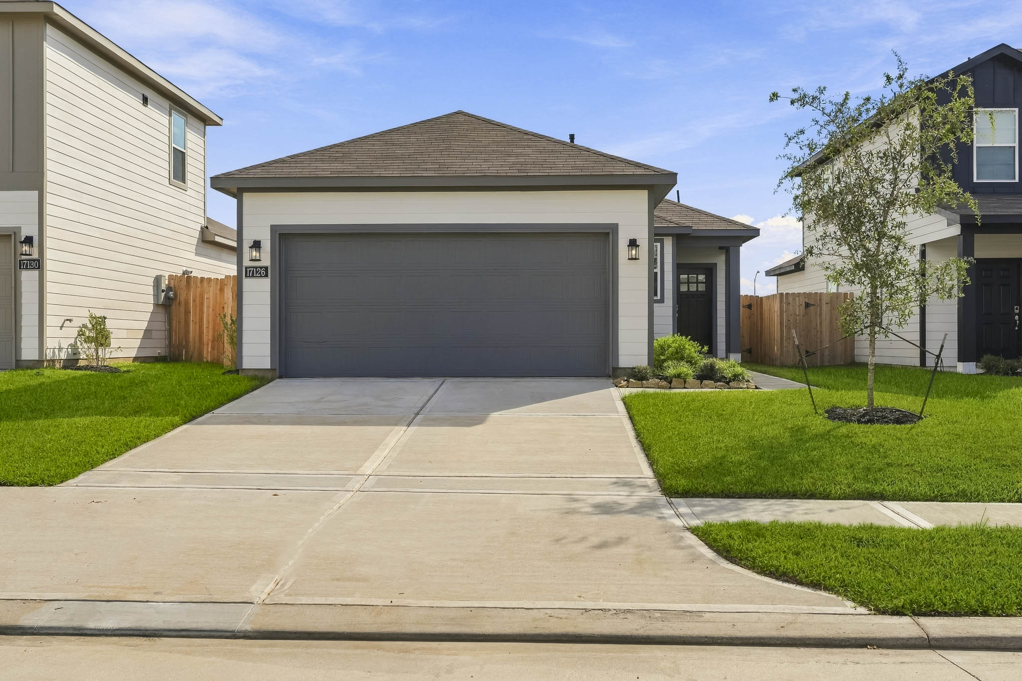A driveway leading to a house.
