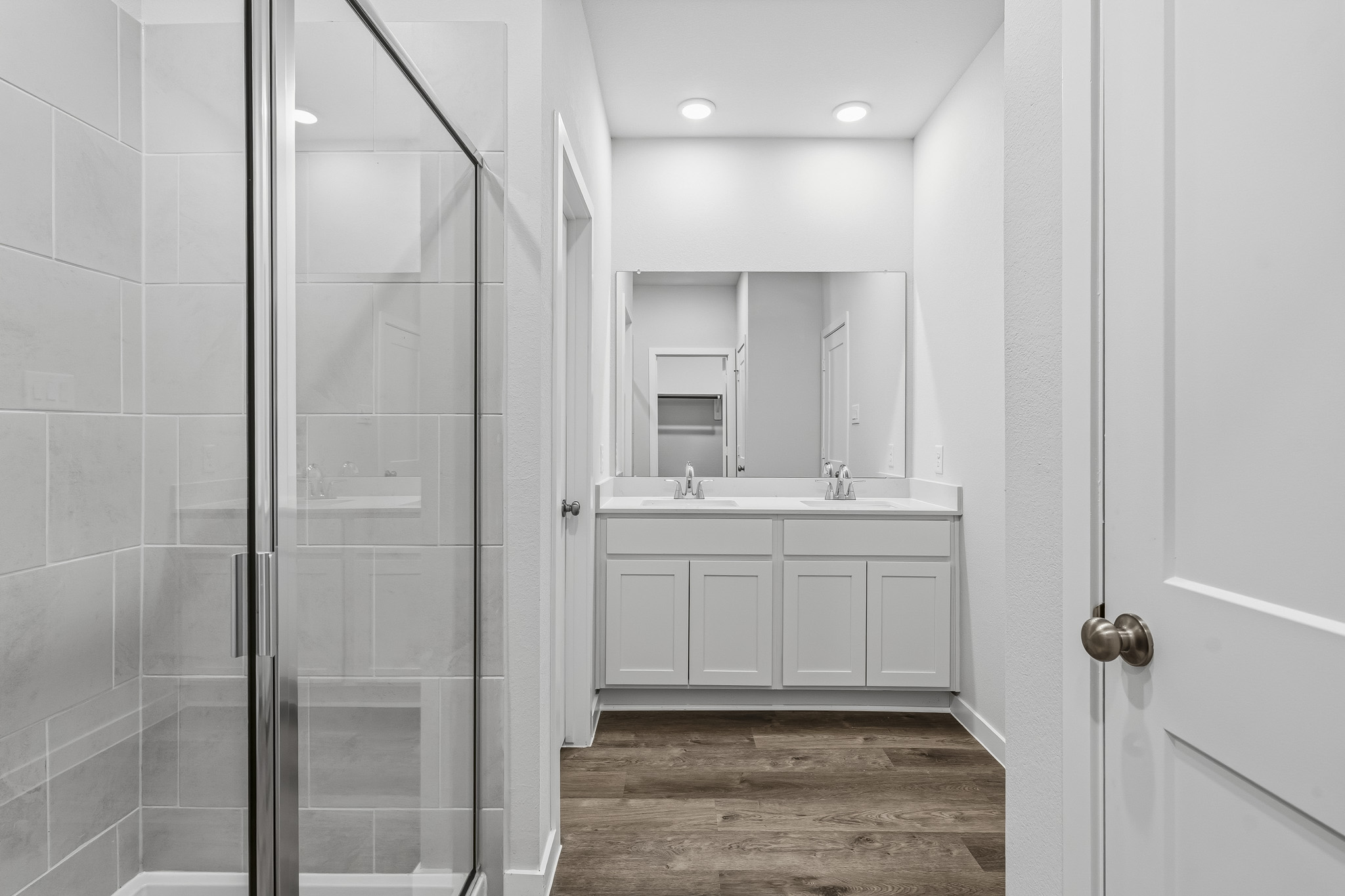 A bathroom with a glass shower.