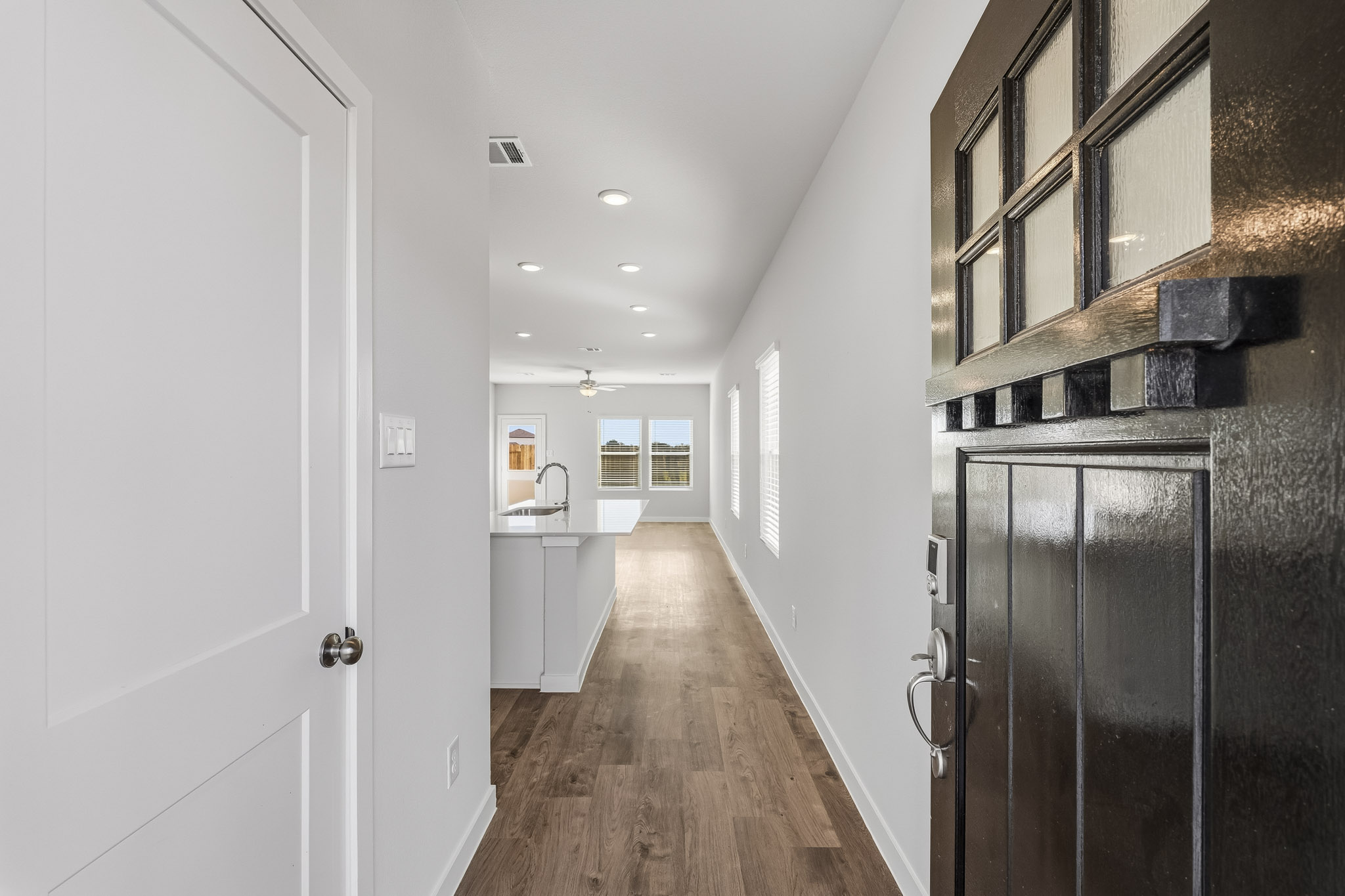 A bathroom with a wood floor.