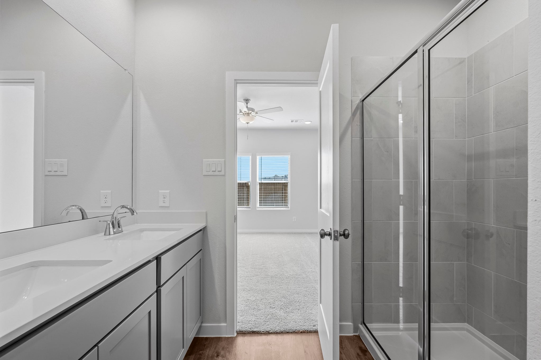 A bathroom with a glass shower.