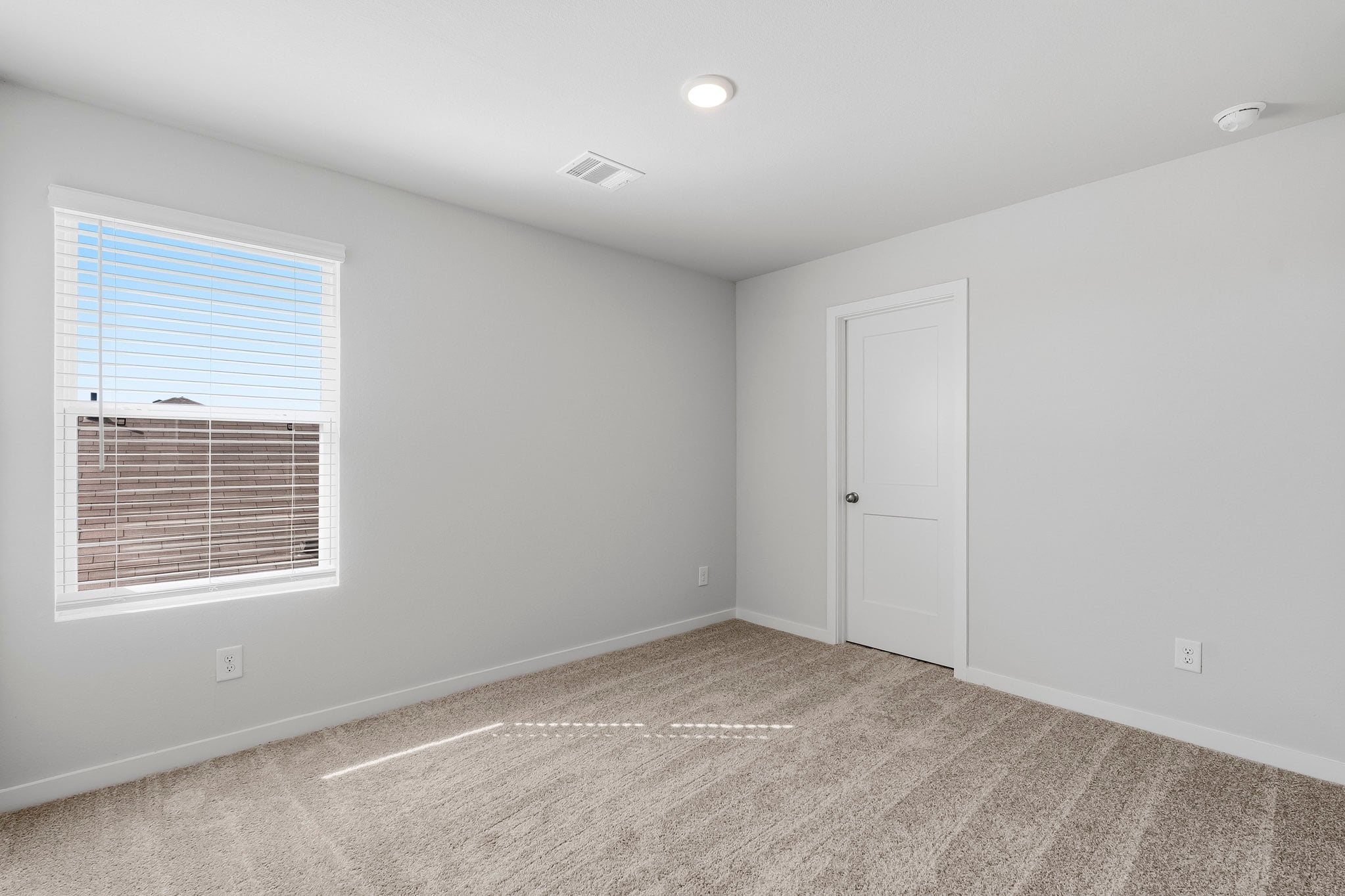 A room with a door and a window.