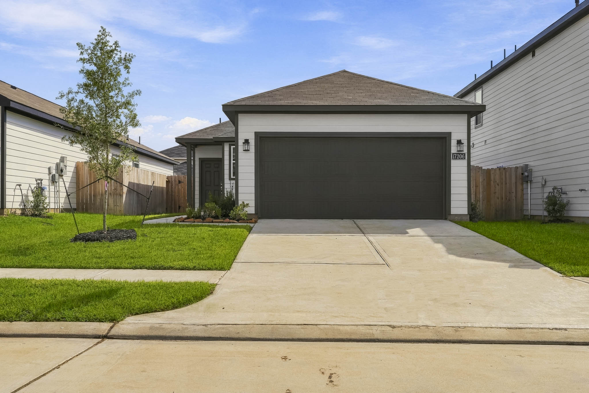 A driveway leading to a house.