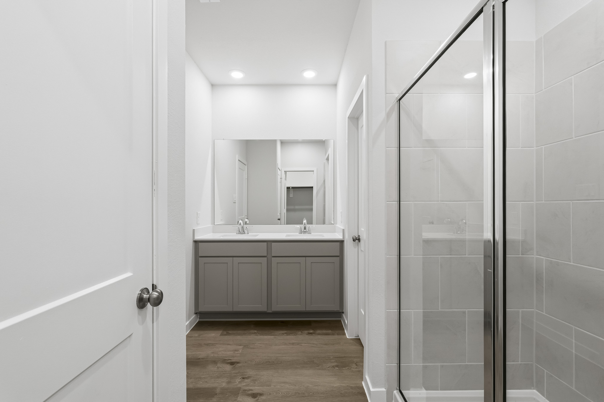 A bathroom with a glass shower.