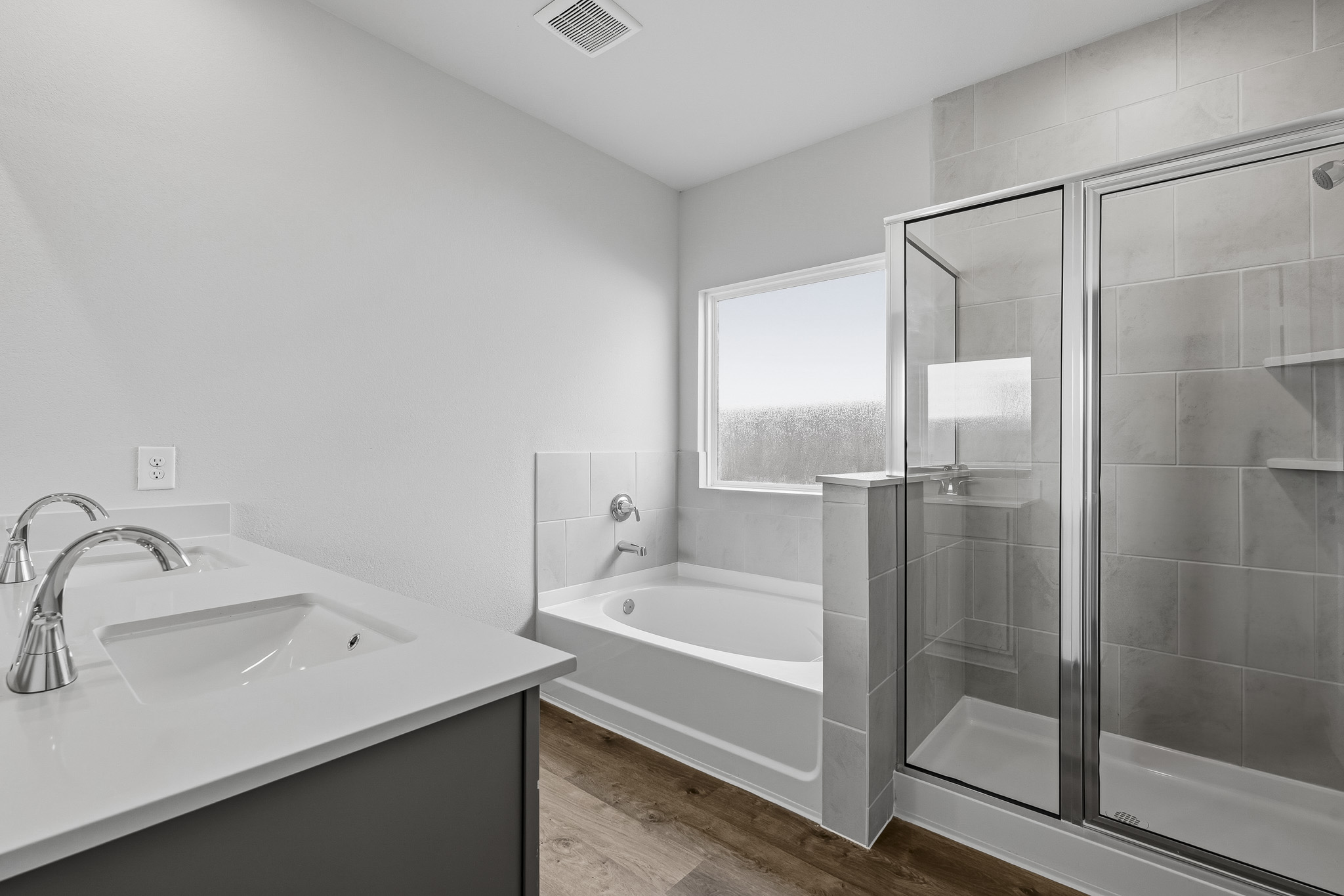 A bathroom with a glass shower.