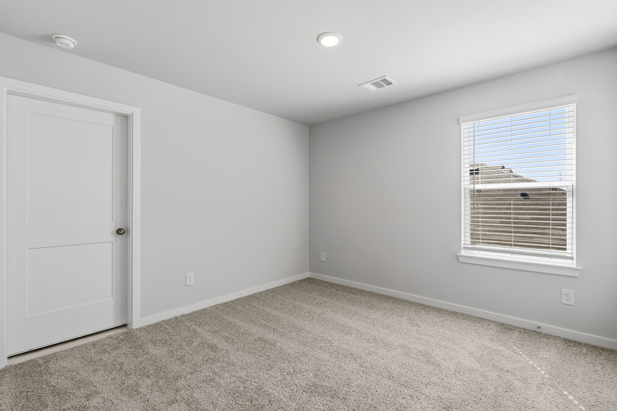 A room with a door and a window.