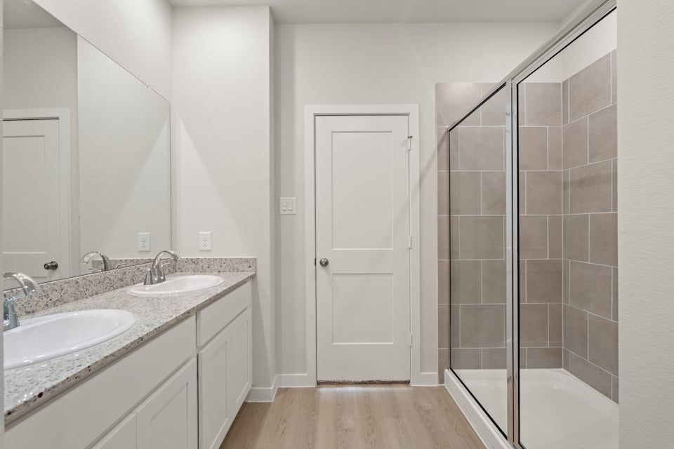A bathroom with a glass shower.