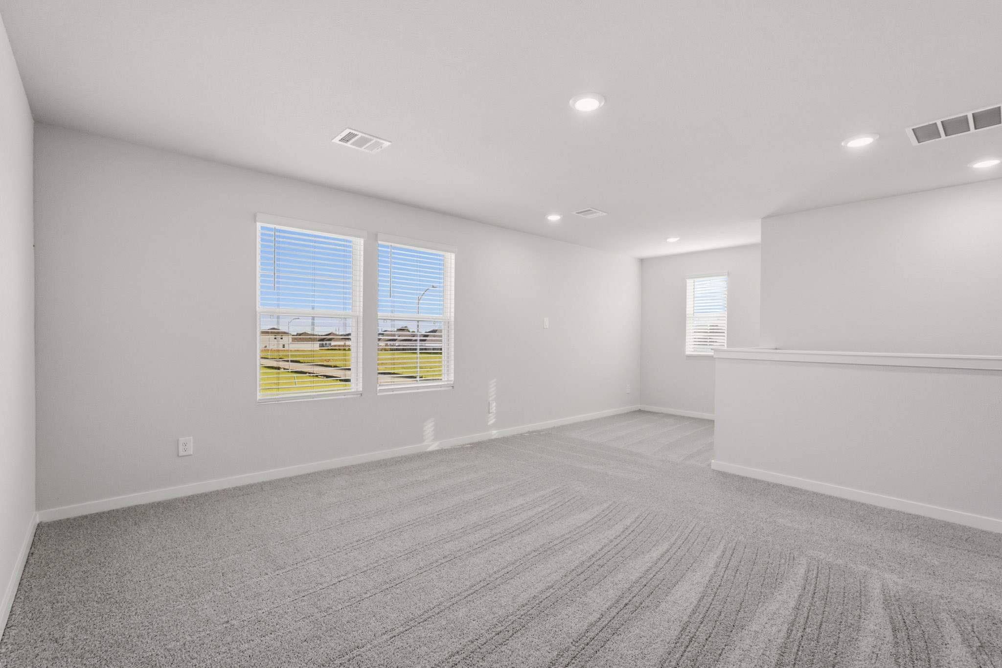 A room with a large window.