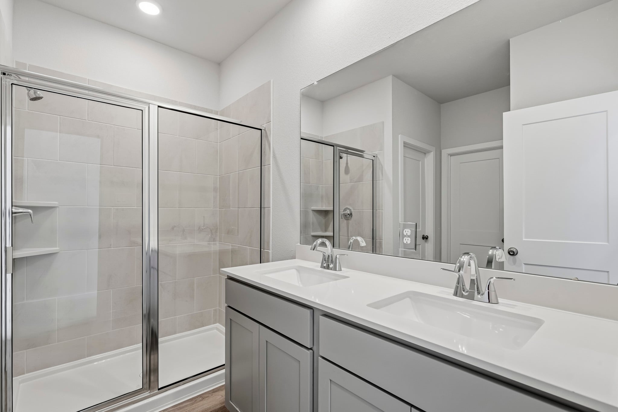A bathroom with a glass shower.