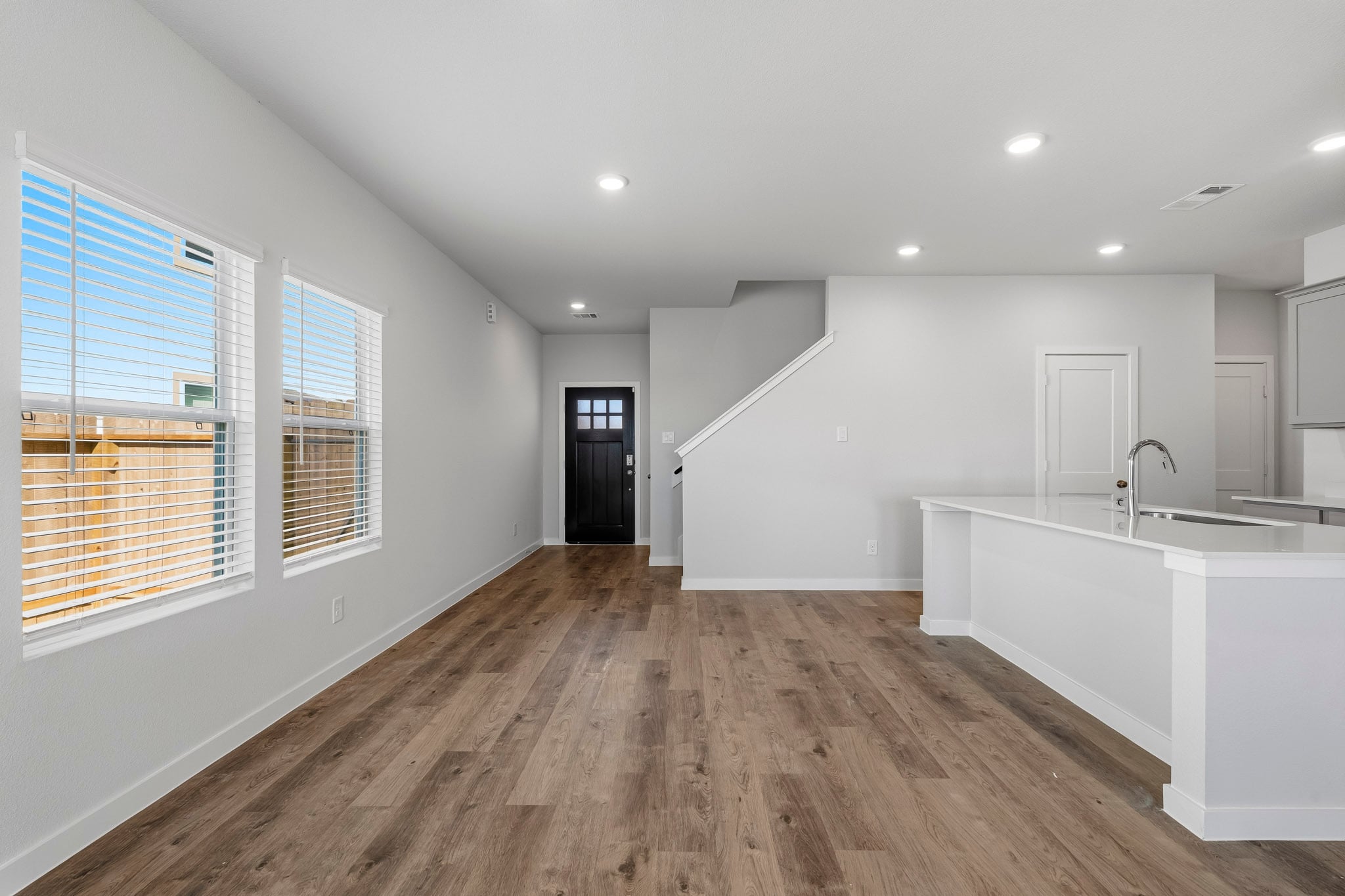 A bathroom with a wood floor.