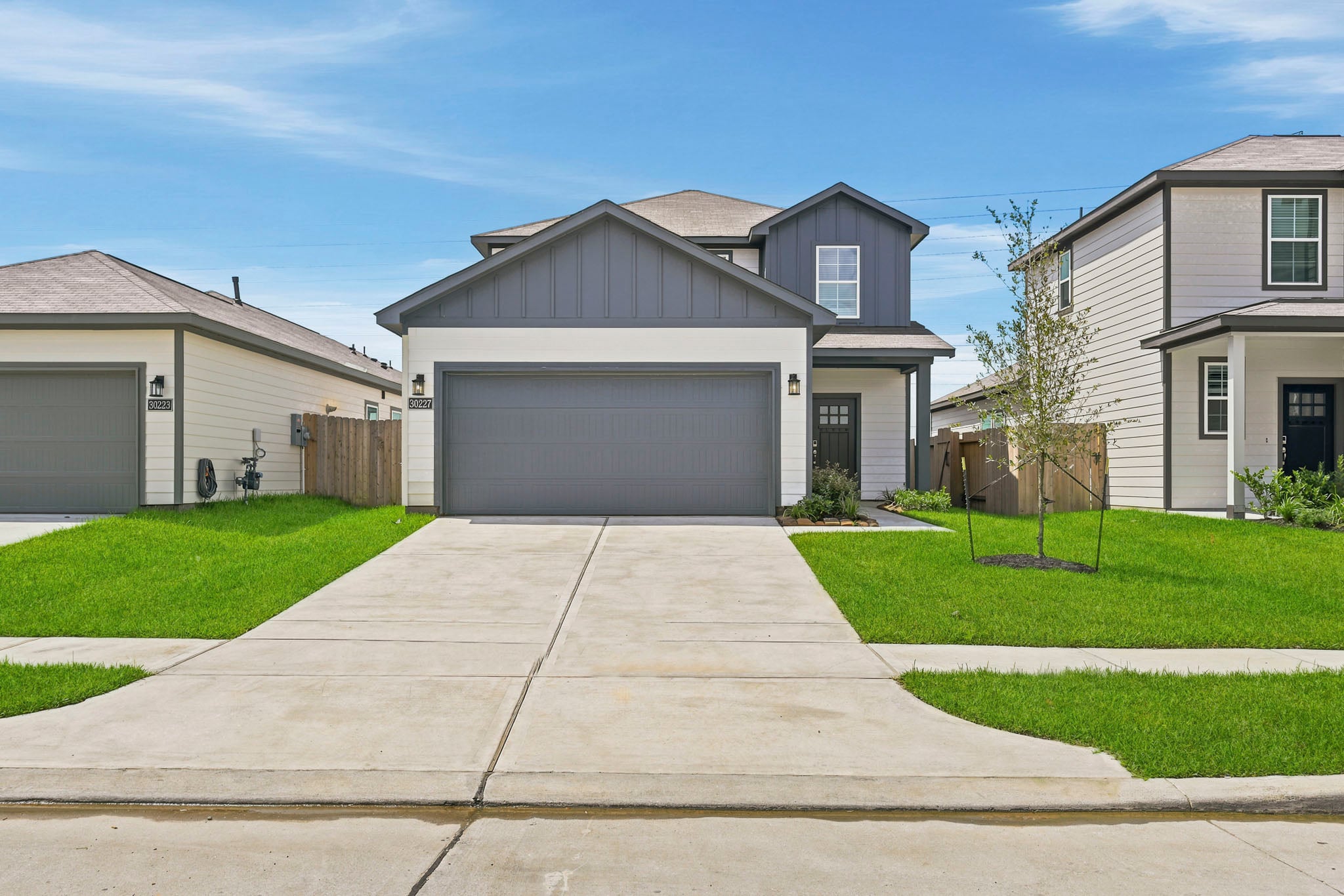 A driveway leading to a house.