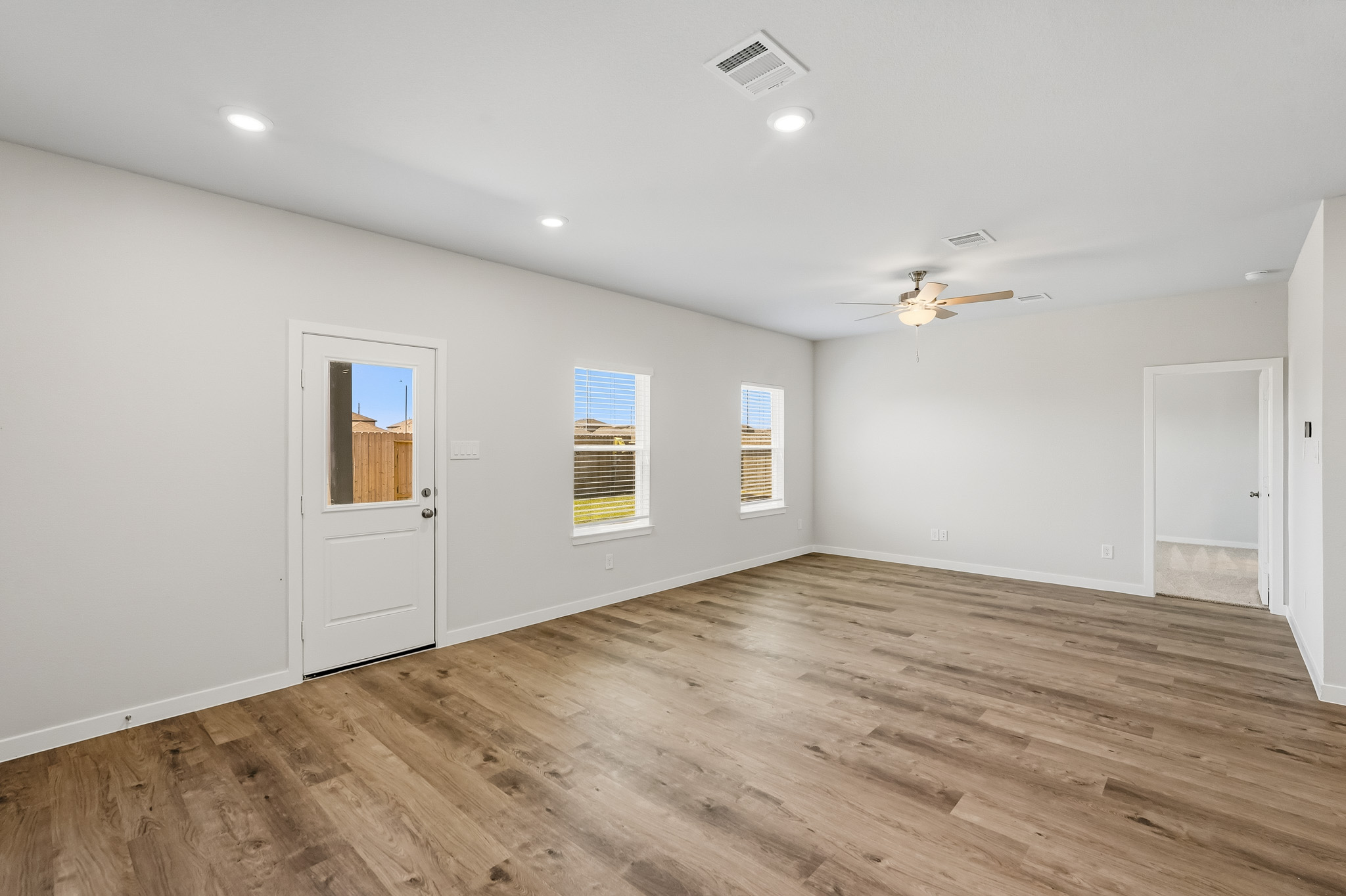 A room with a wood floor and a wood floor.