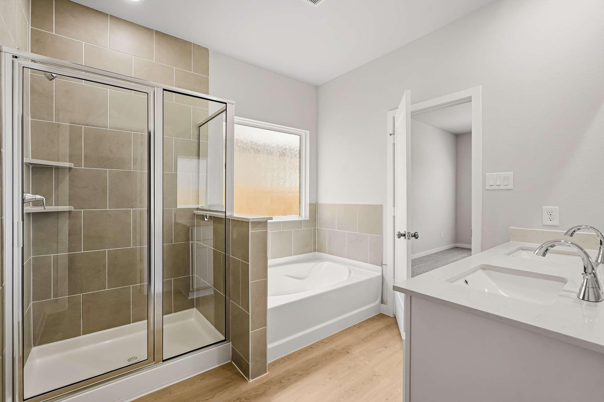 A bathroom with a glass shower.