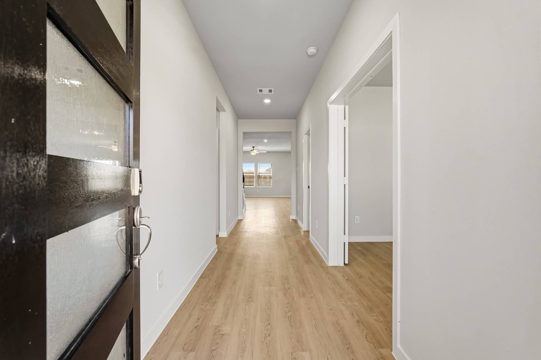 A hallway with white walls.