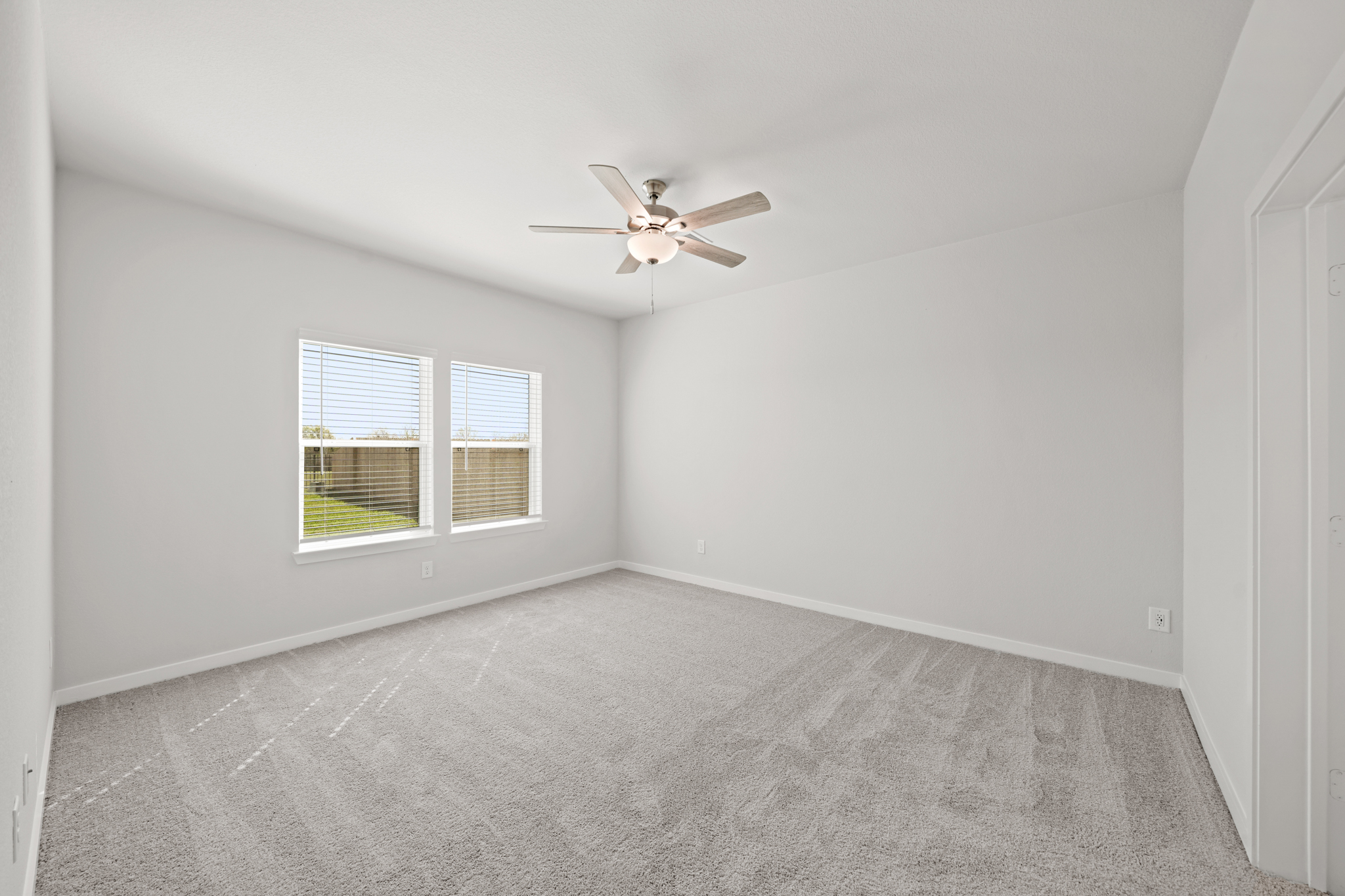 A ceiling fan in a room.