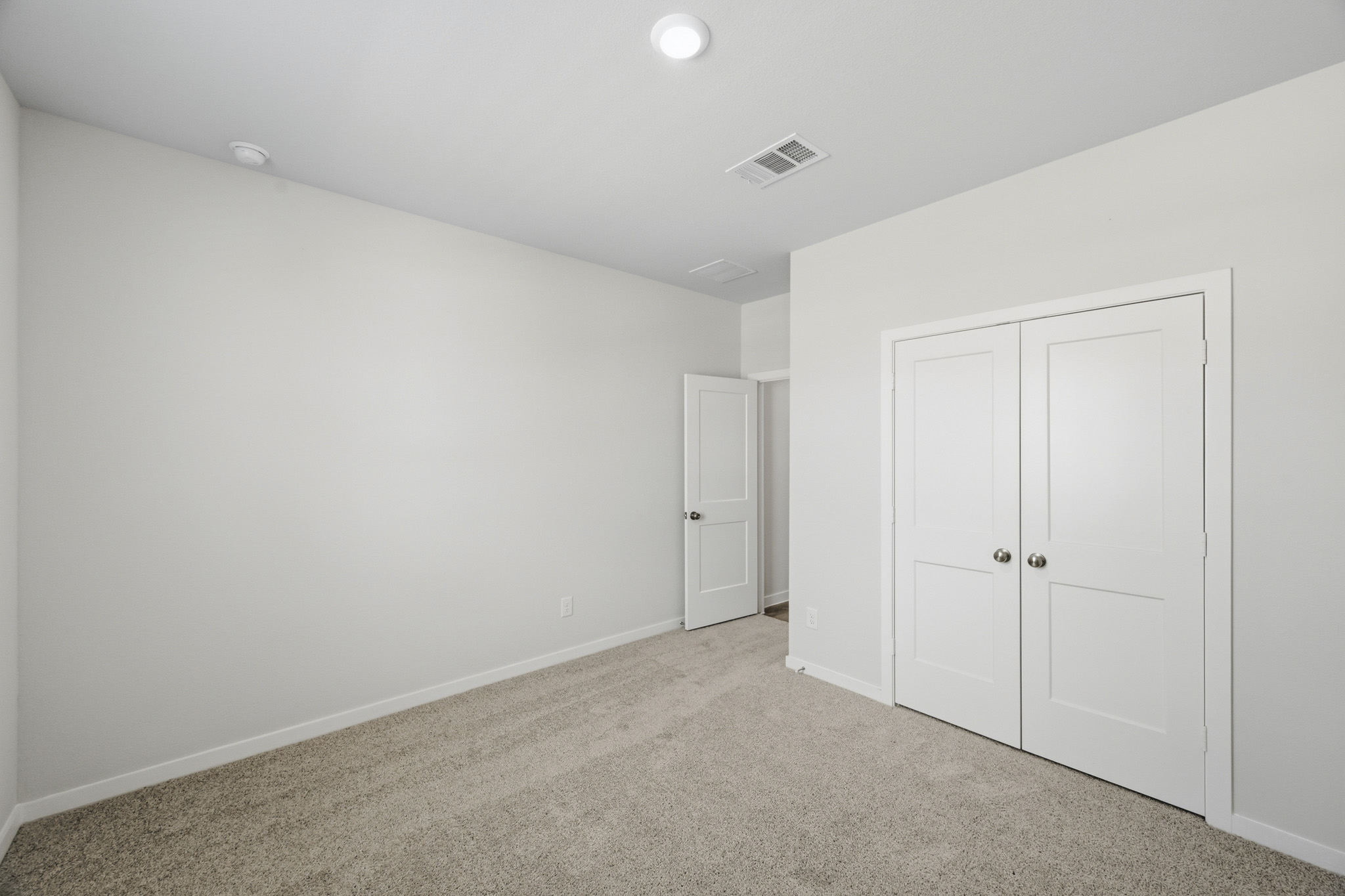 A room with white doors.