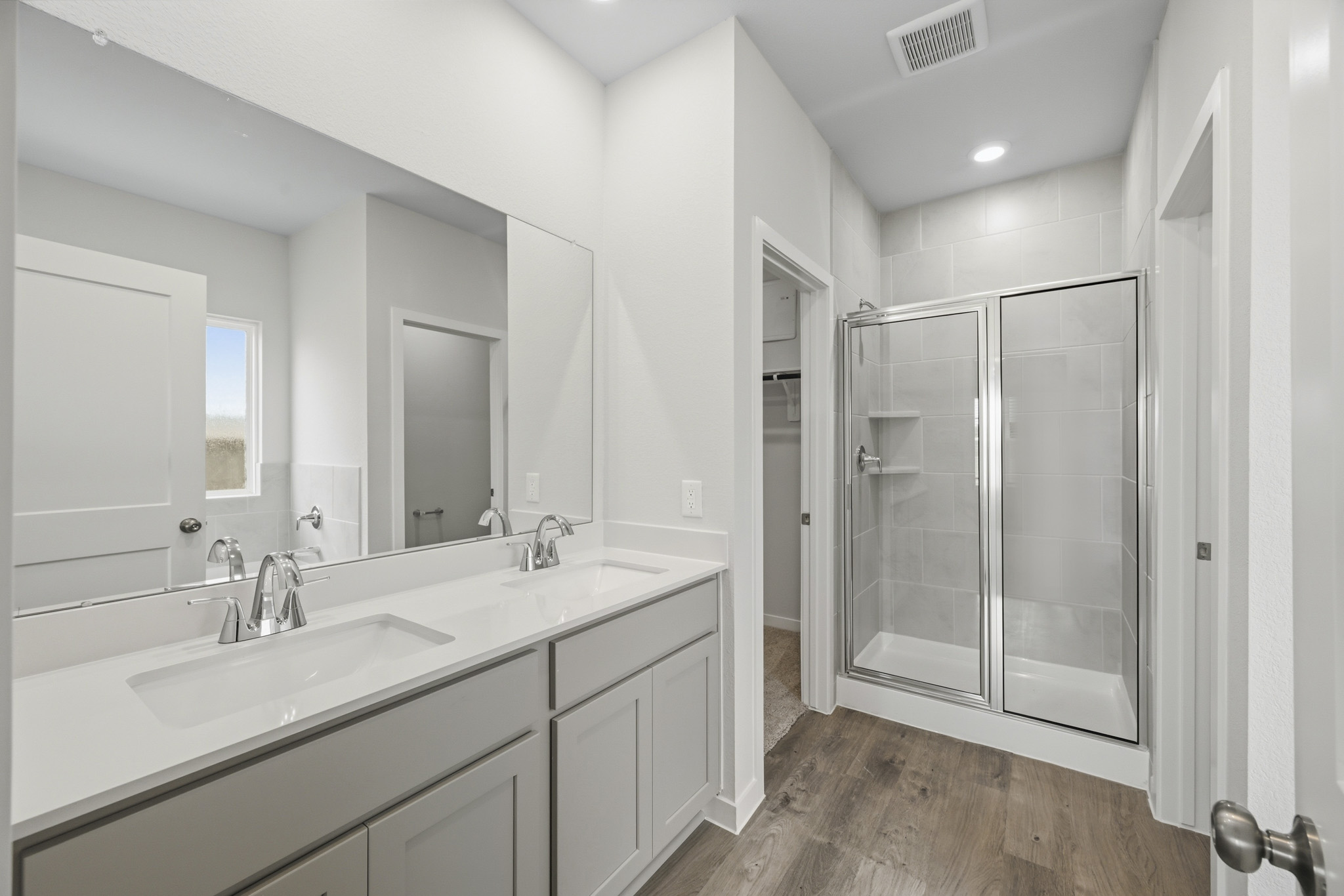 A bathroom with a glass shower.