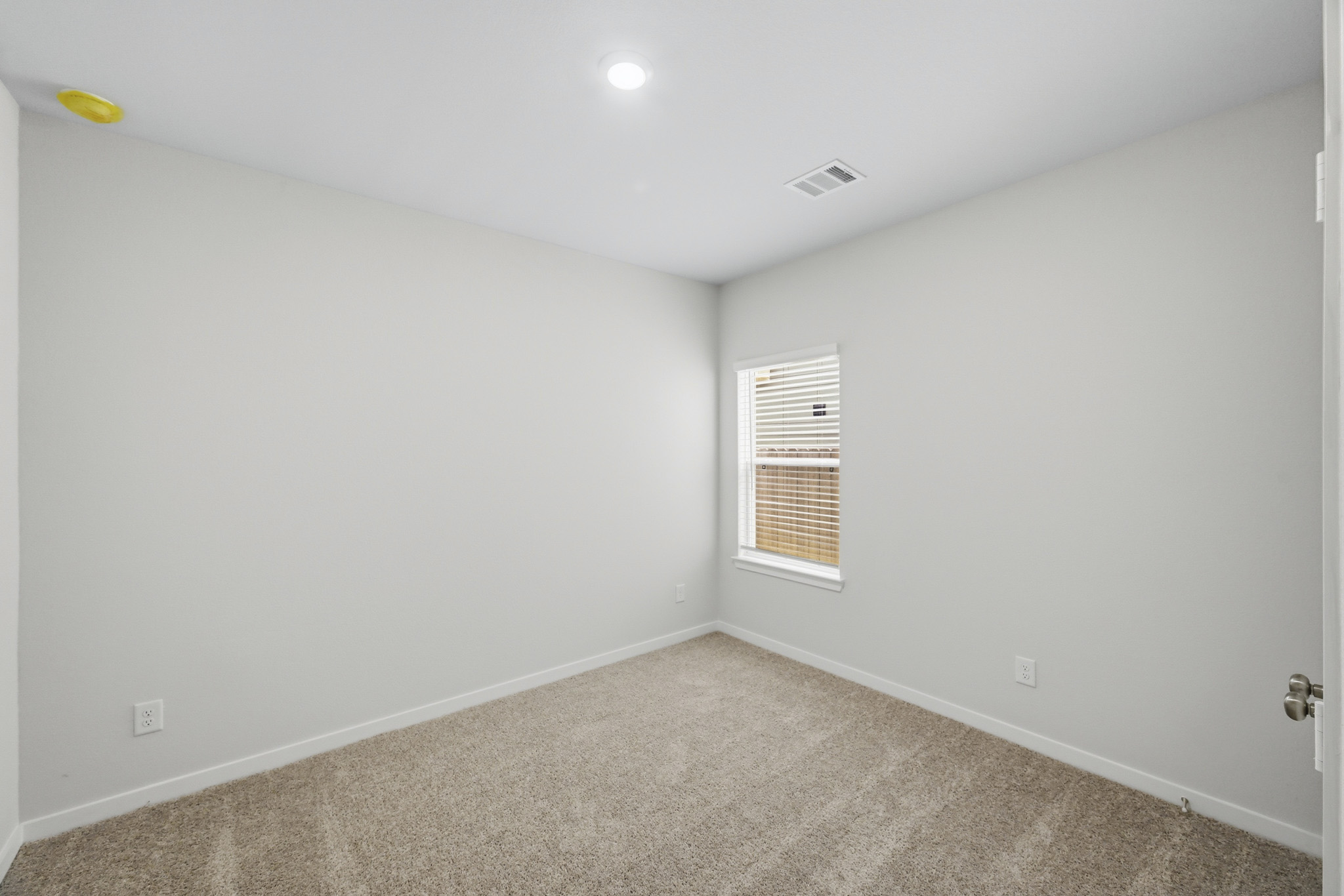 A room with a door and a window.