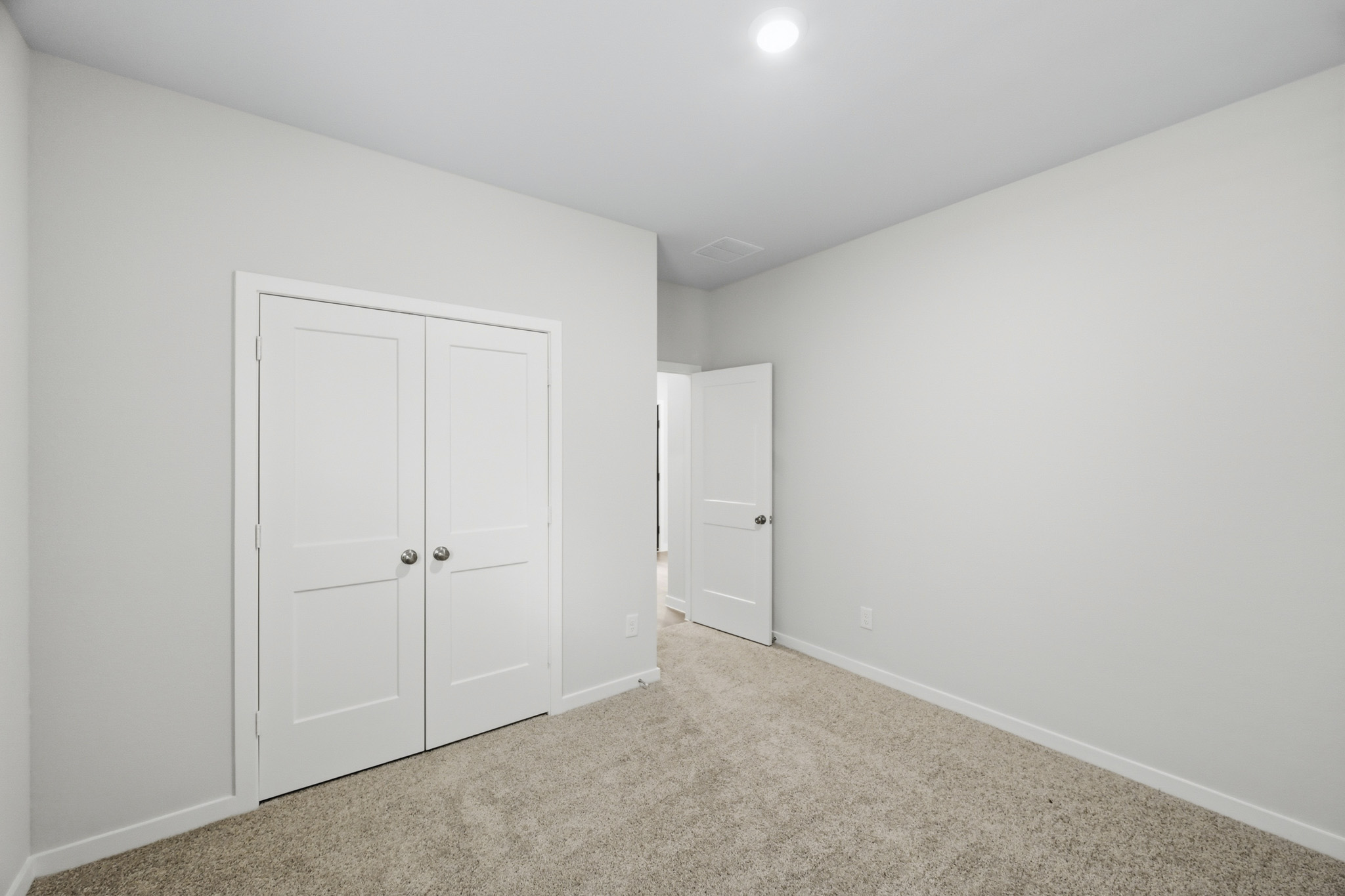 A room with white doors.