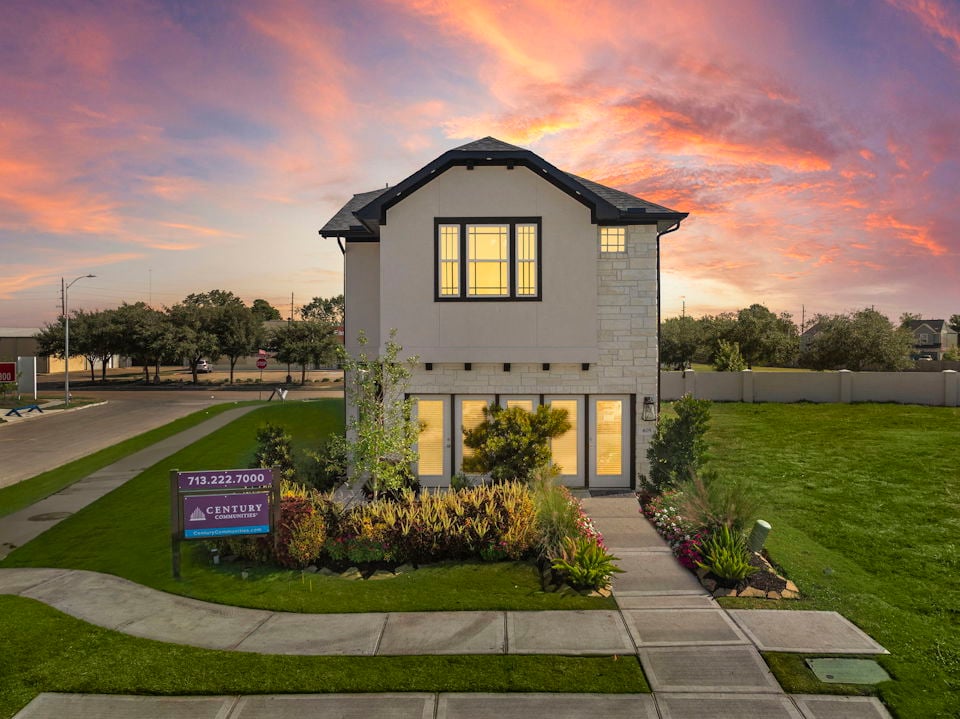 A small house with a driveway.