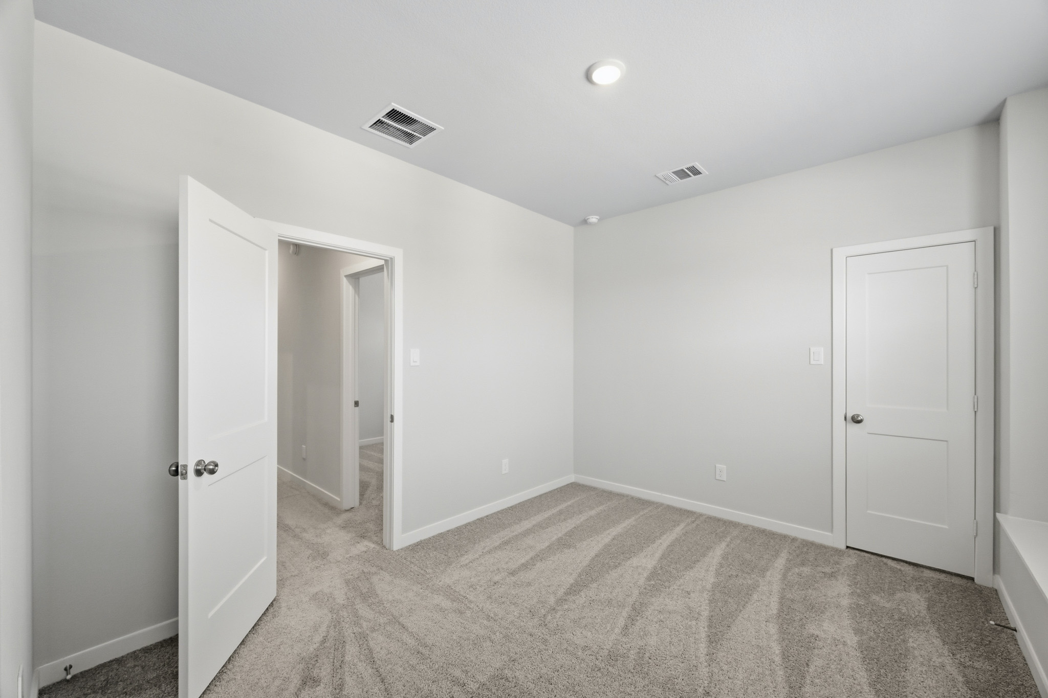 A room with white doors.