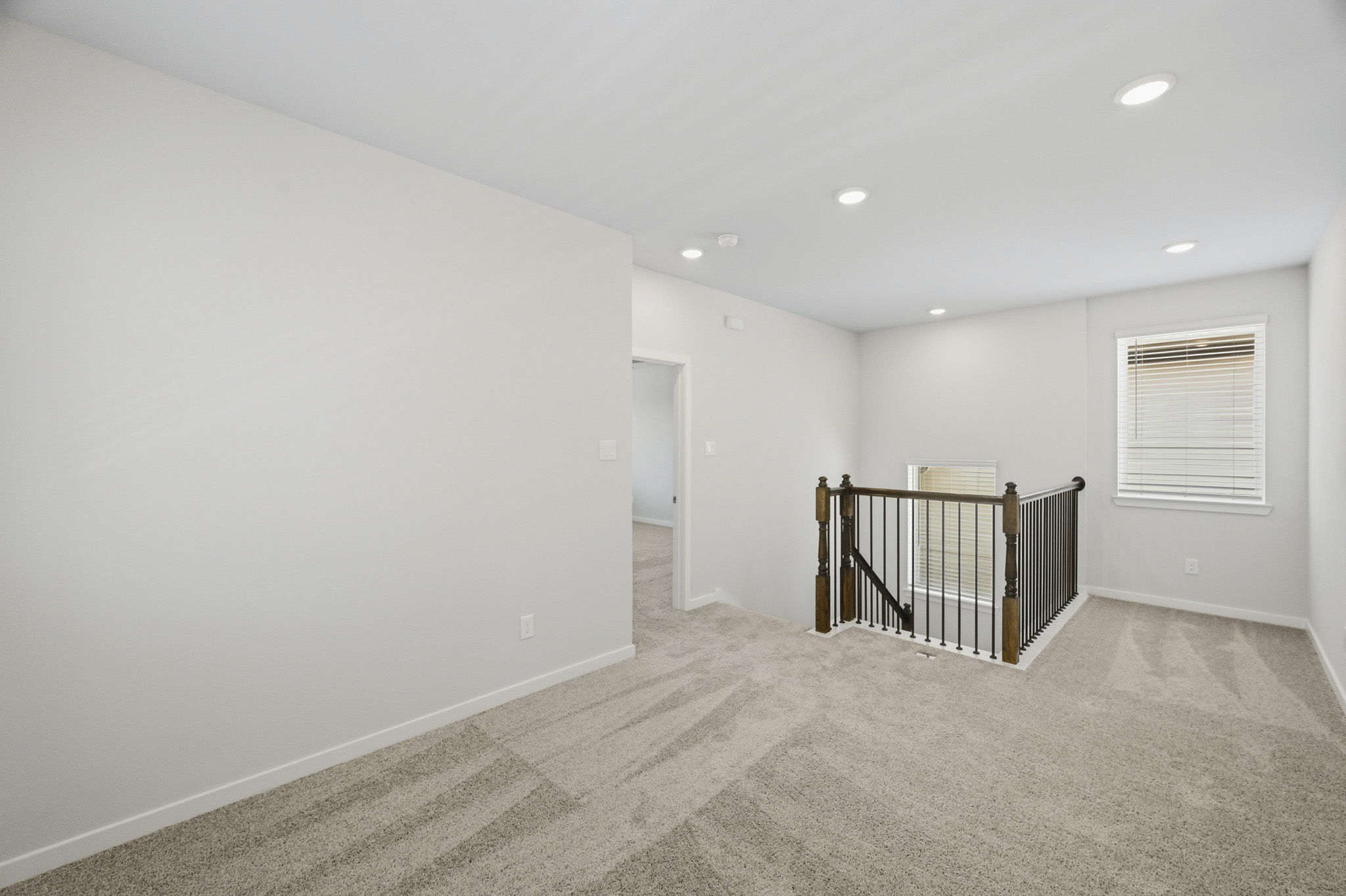 A room with a metal gate.