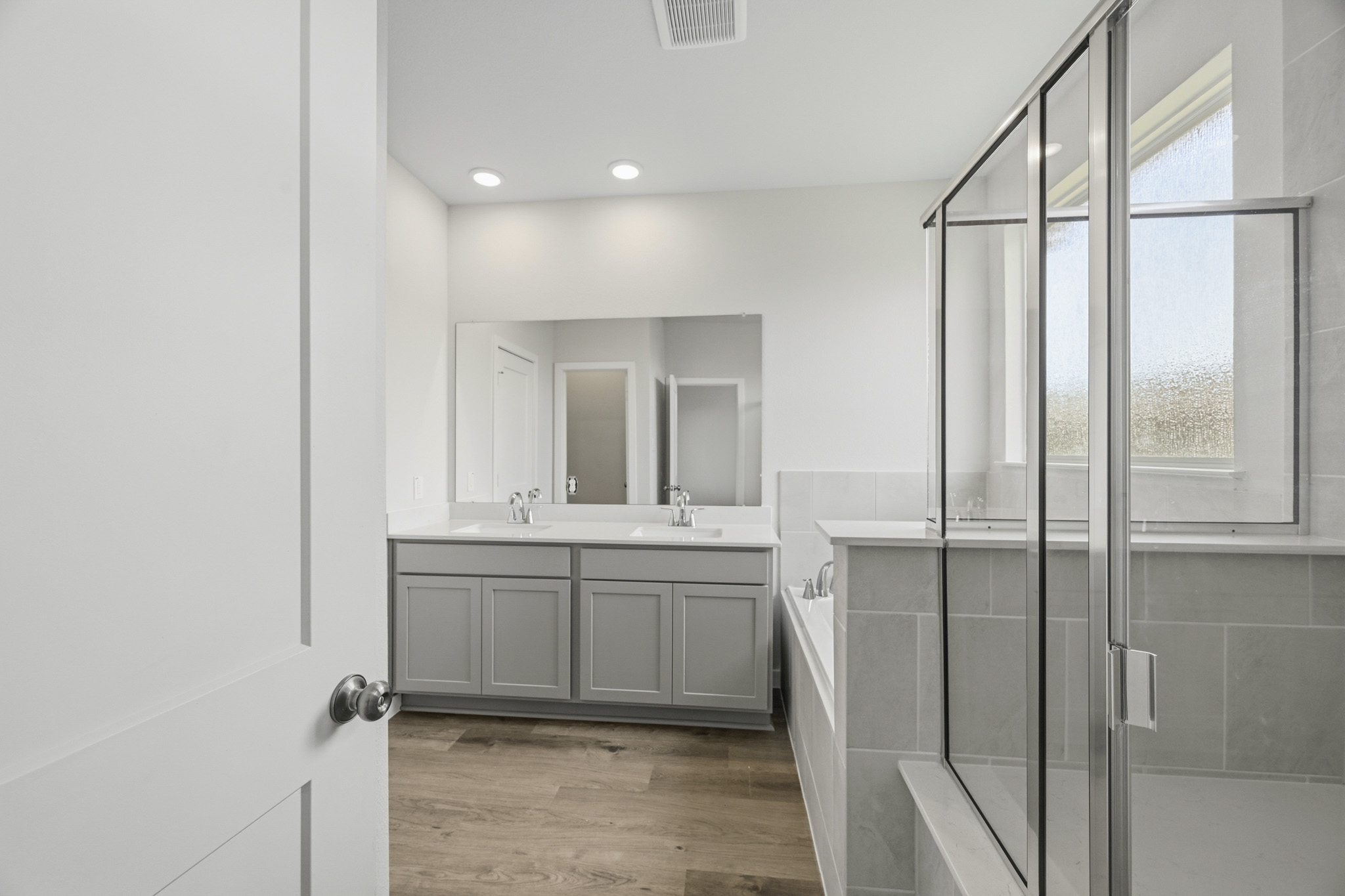 A bathroom with a glass shower.