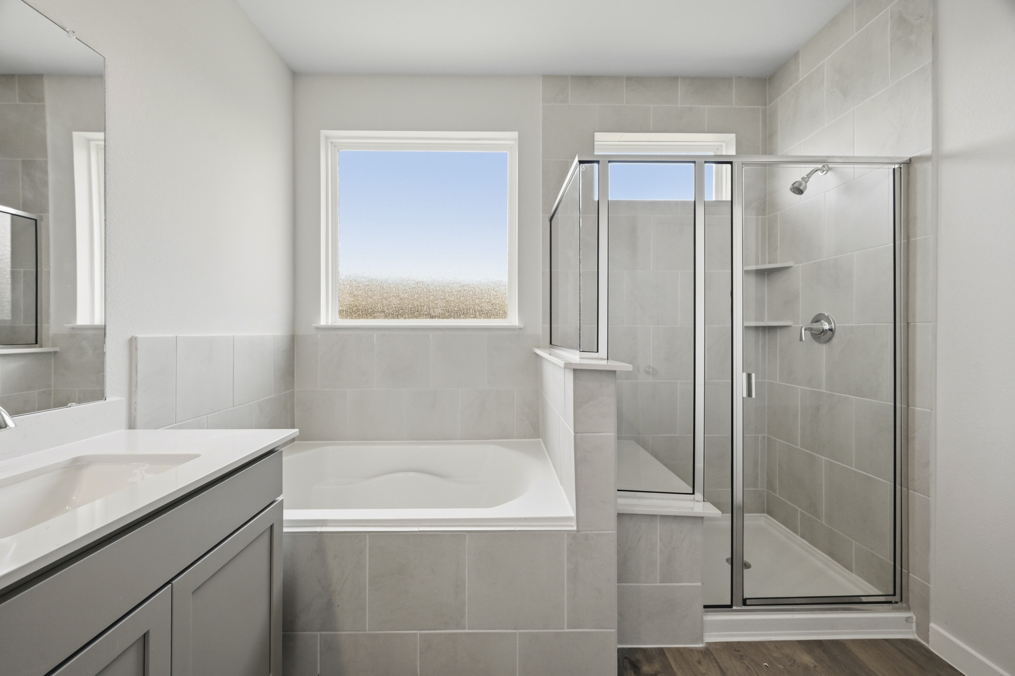 A bathroom with a glass shower.