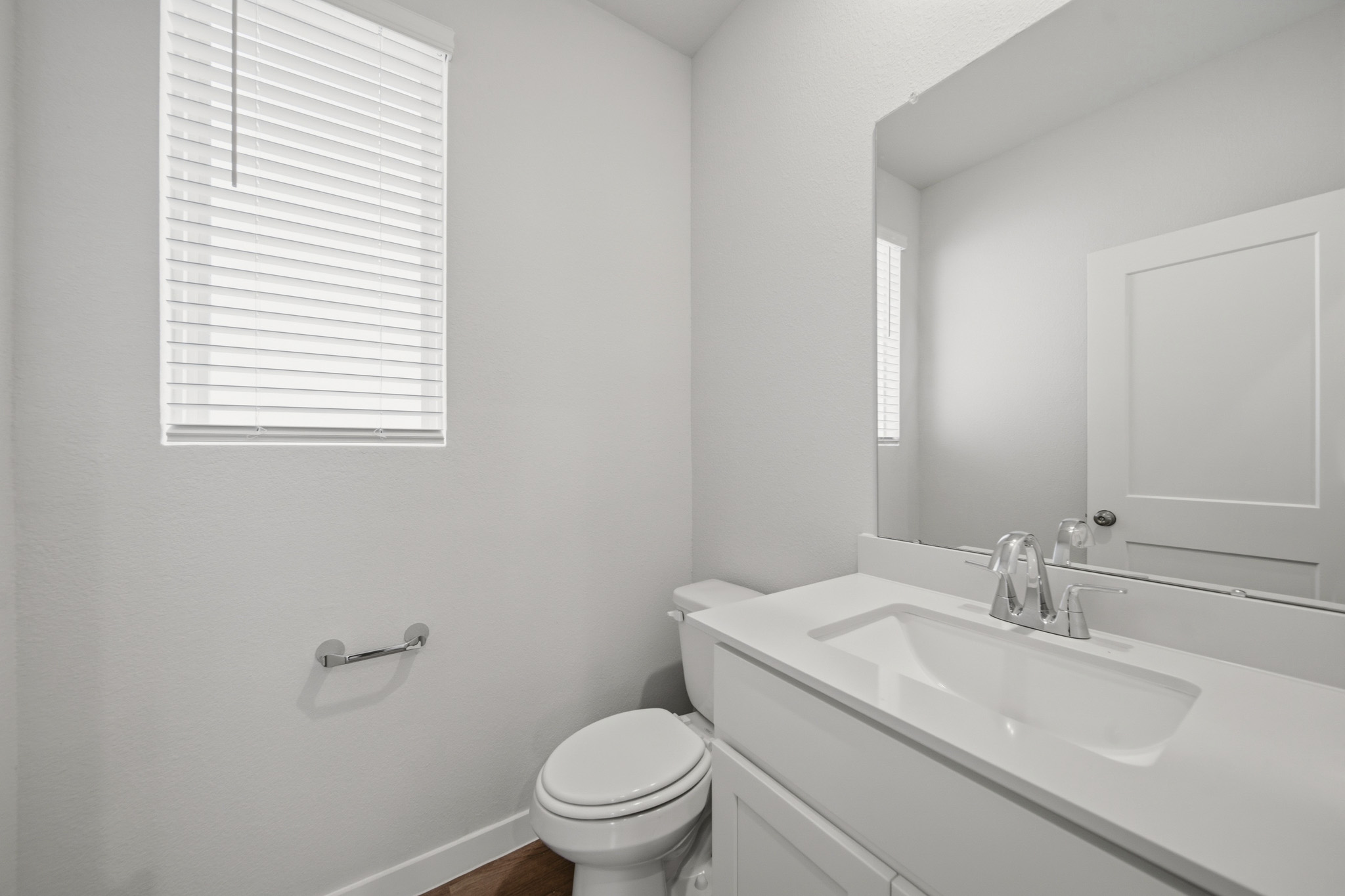 A bathroom with a sink and toilet.