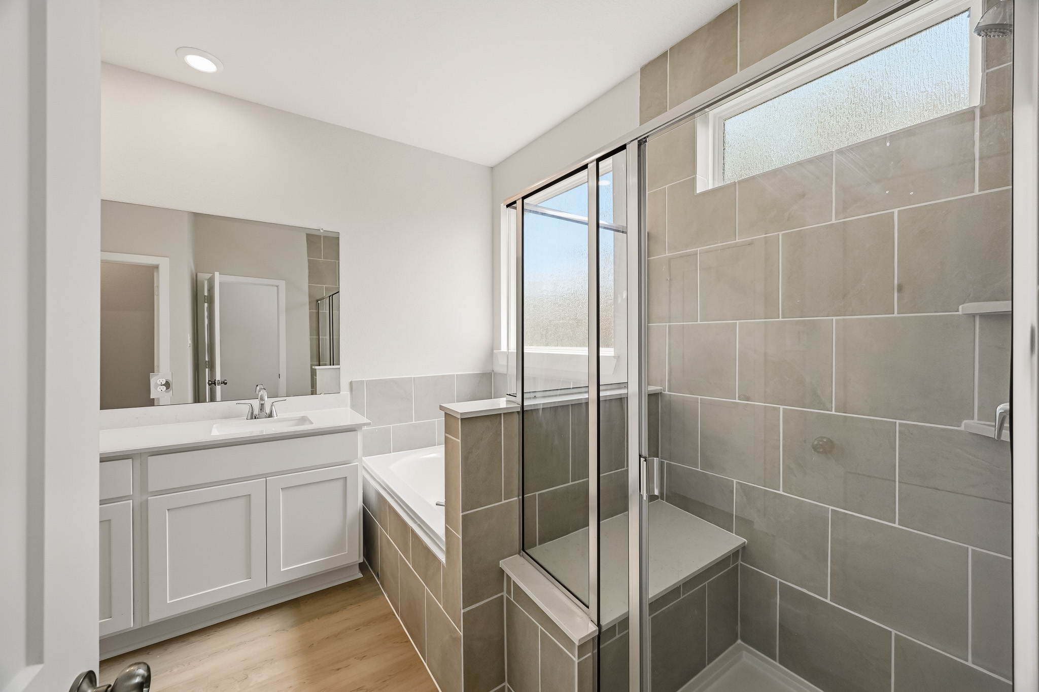 A bathroom with a glass shower.