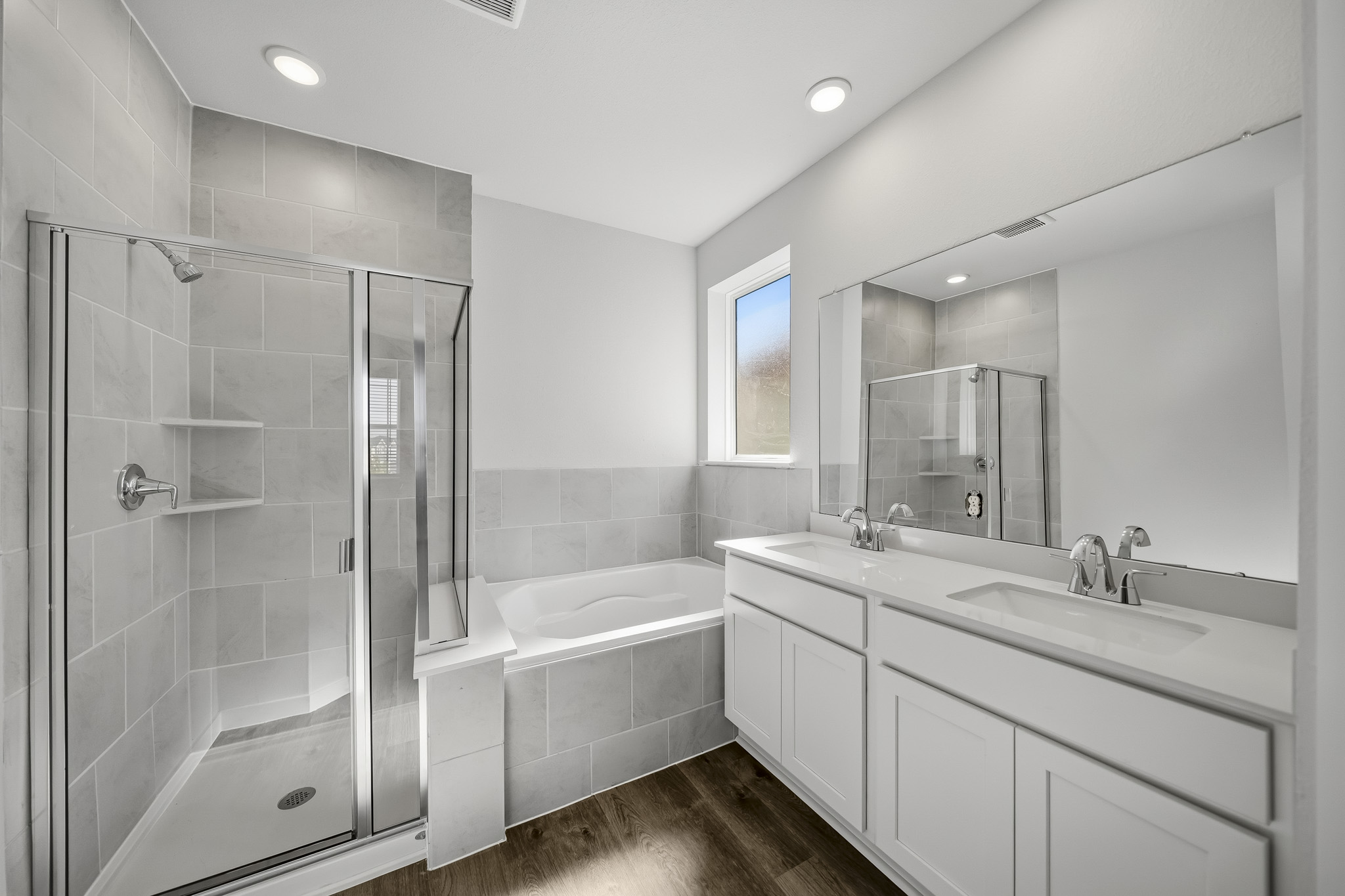 A bathroom with a glass shower.