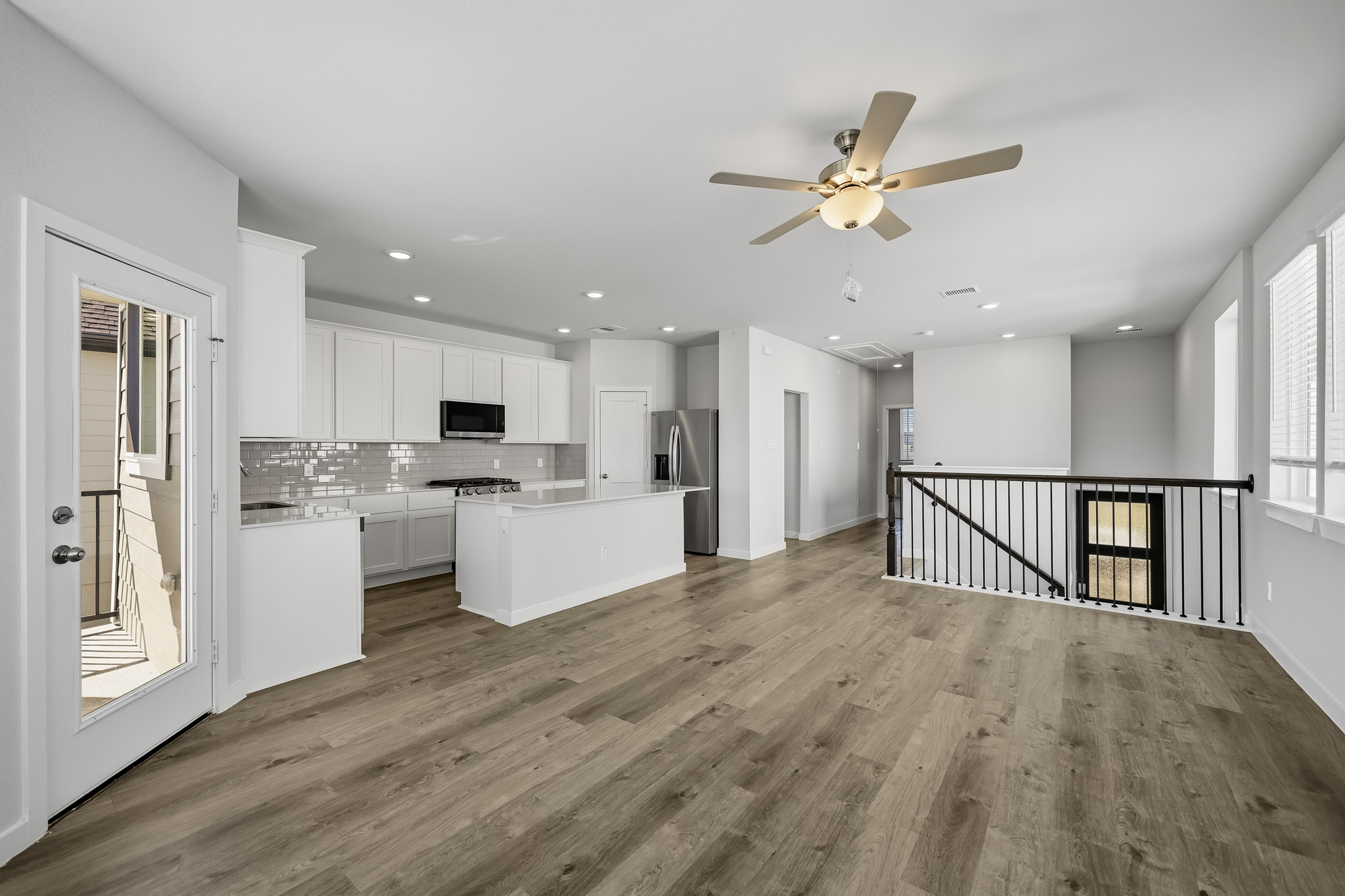 A large kitchen with white cabinets.